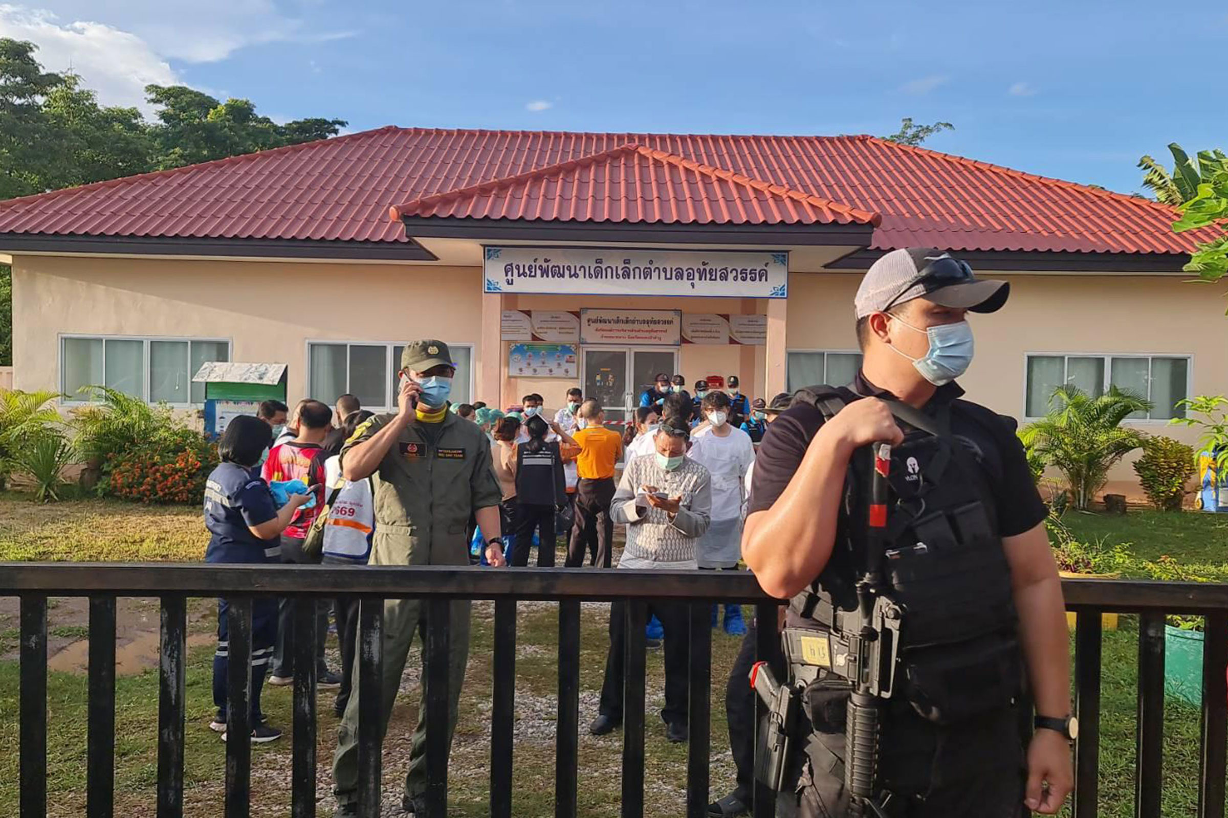 A police officer stands guard at the childcare center where a shooting took place in Nong Bua Lamphu province, Thailand, on Oct. 6, 2022.