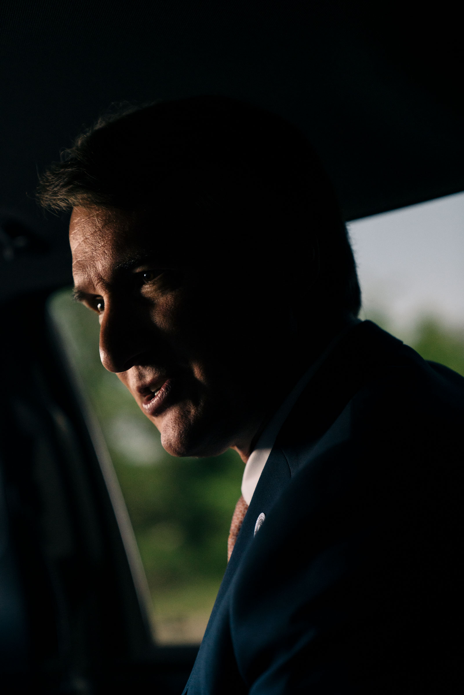 Virginia Gov. Glenn Youngkin seated in a car