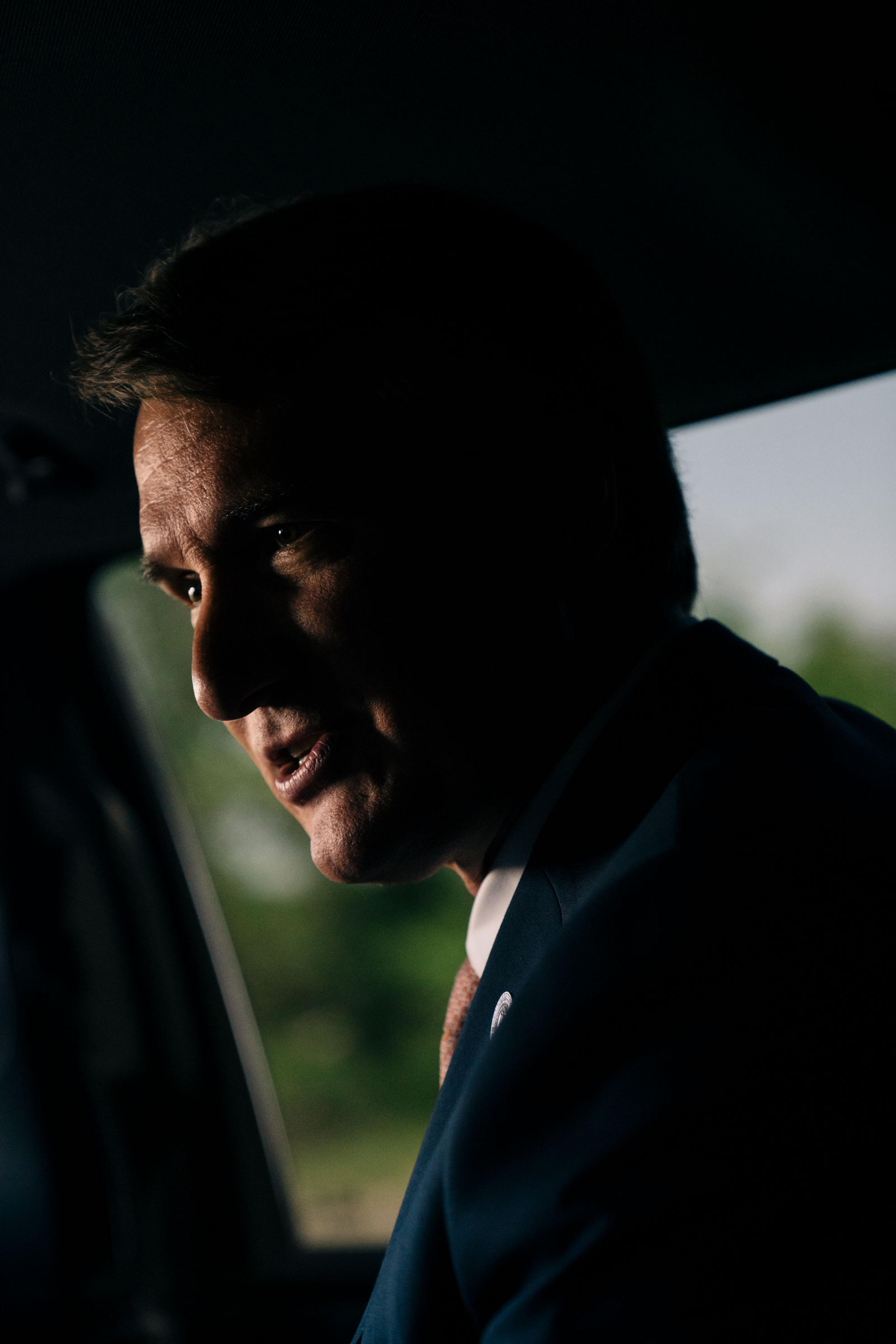 Virginia Gov. Glenn Youngkin seated in a car