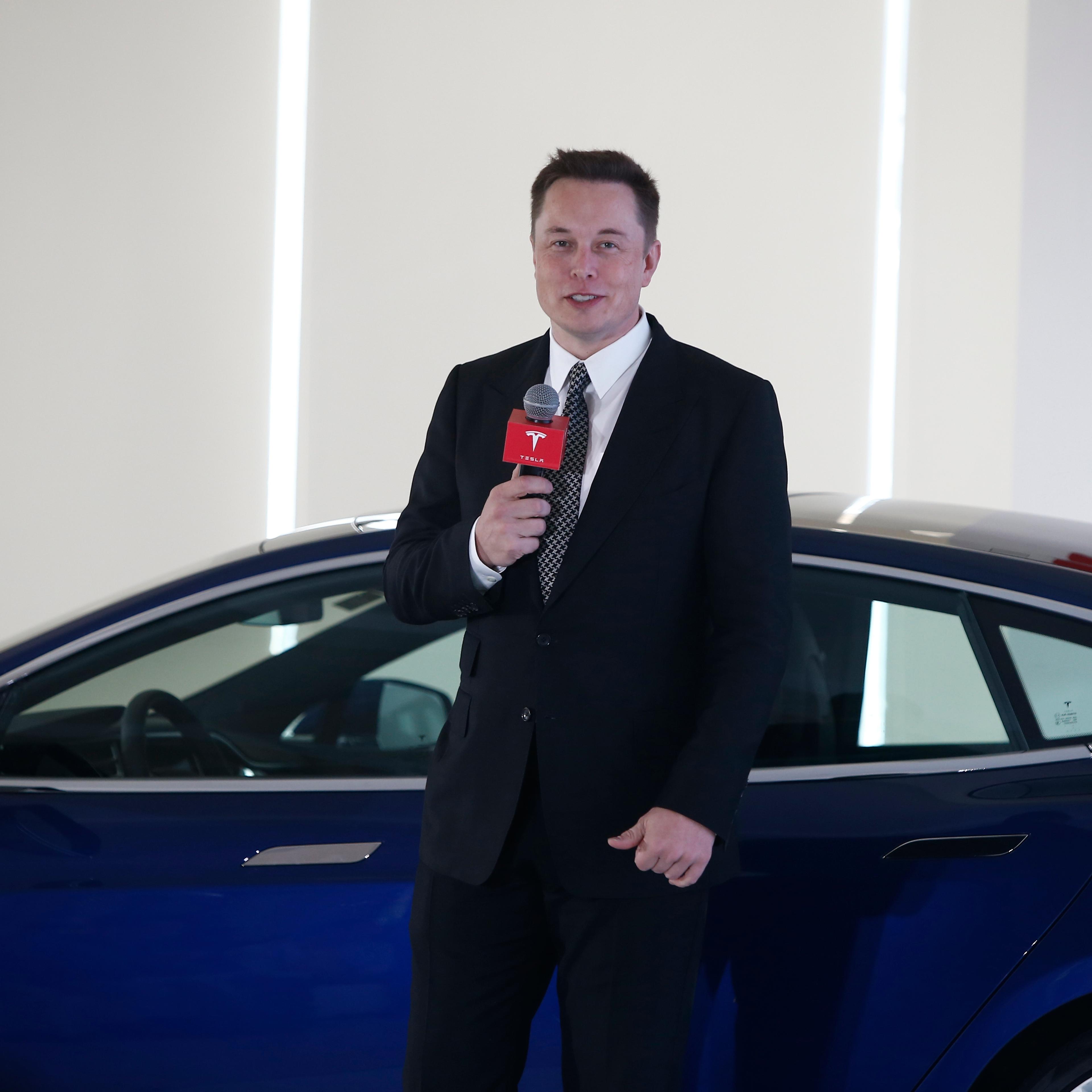 Elon Musk, Chairman, CEO and Product Architect of Tesla Motors, addresses a press conference in Beijing.