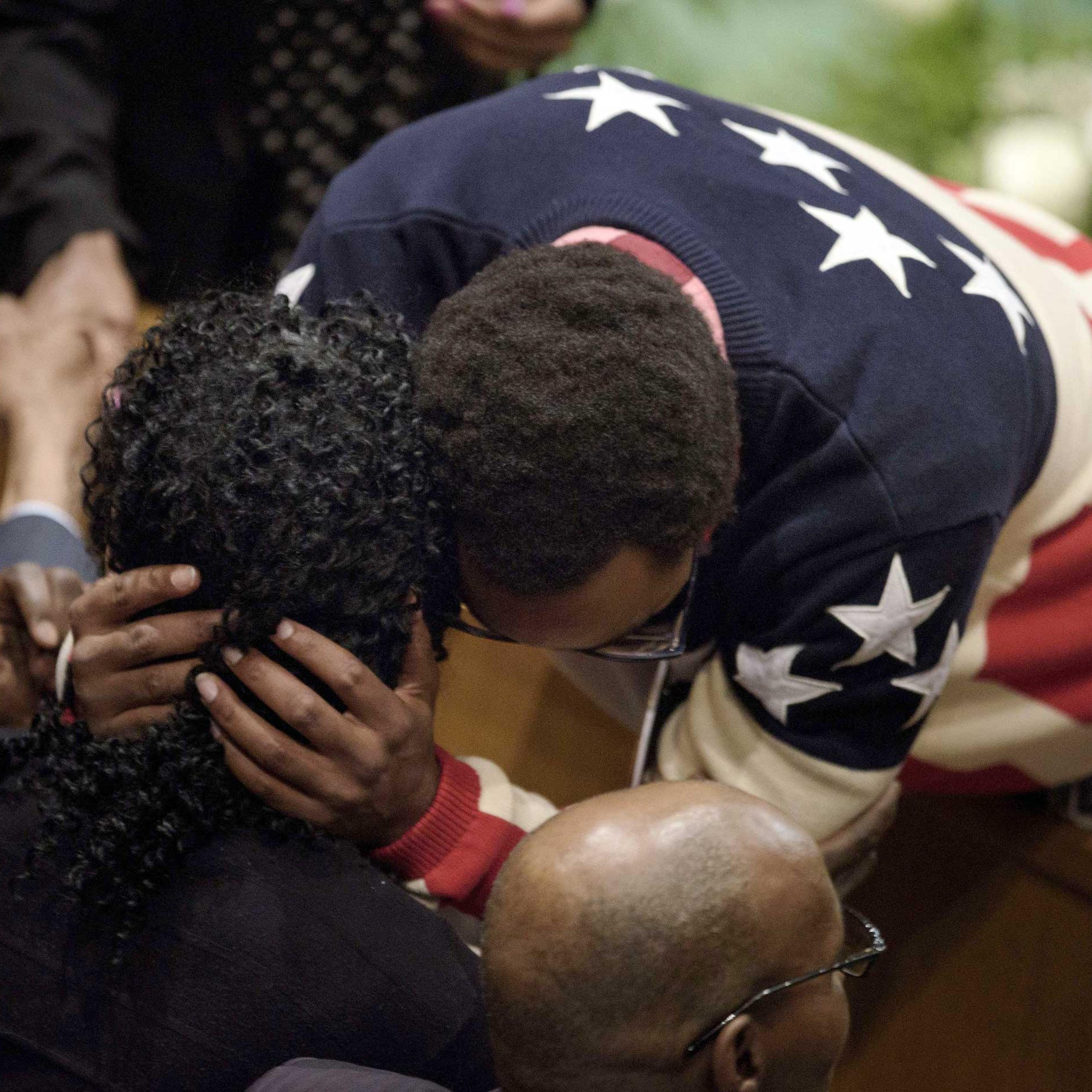 Gloria Darden, mother of Freddie Gray, is embraced before her son's funeral at New Shiloh Baptist Church in Baltimore on April 27, 2015.