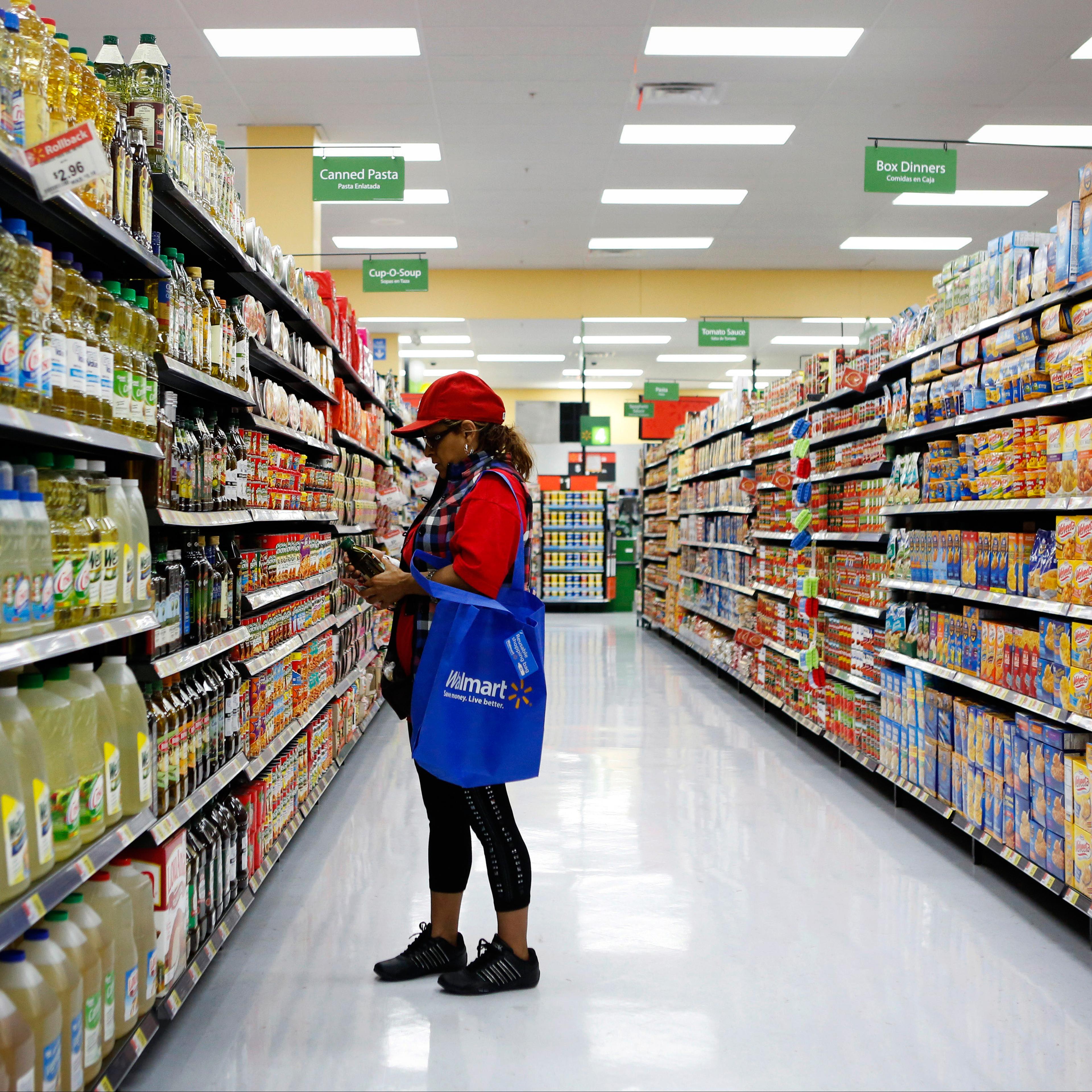 Female shopper in Wal-Mart store aisle