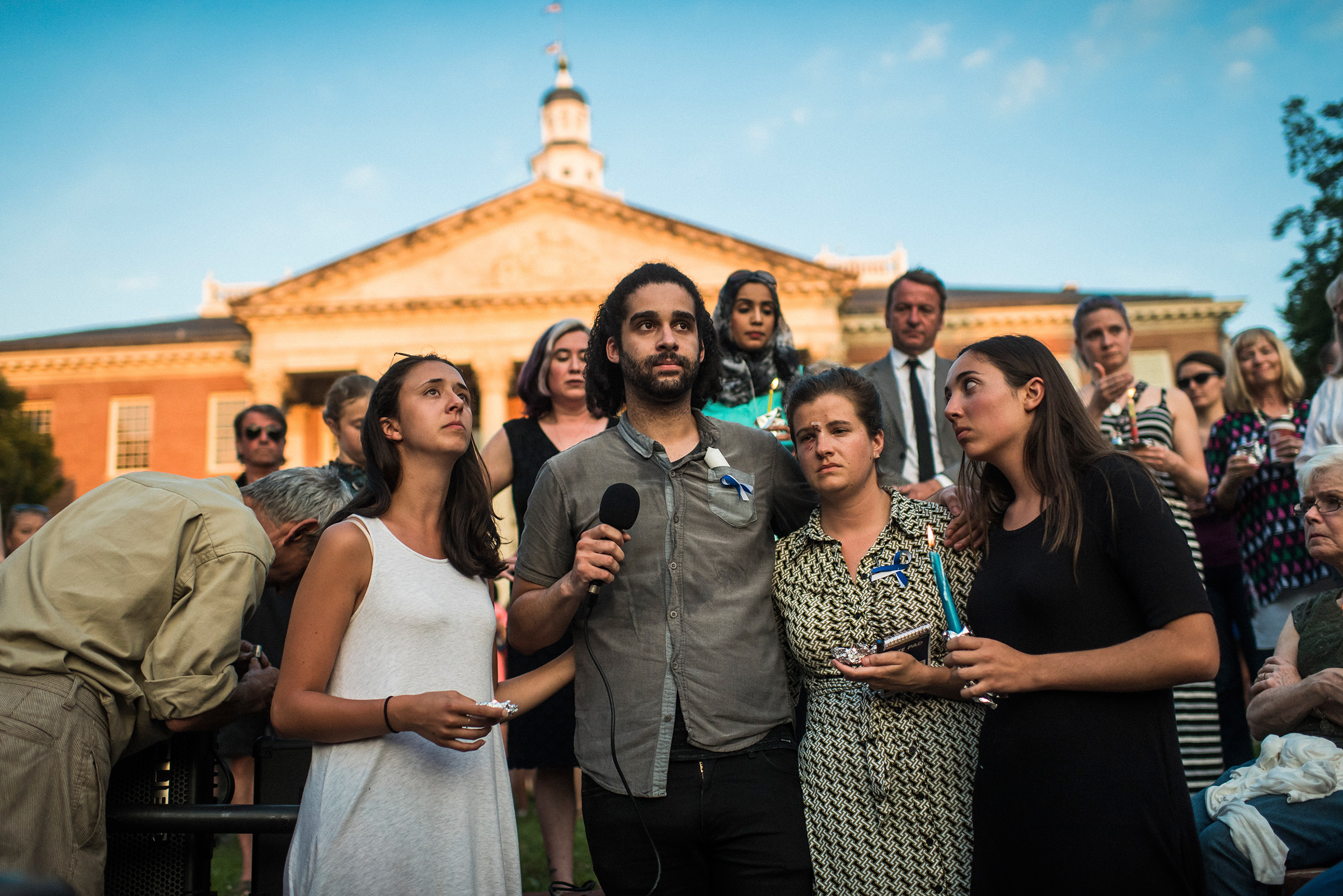 From left: Danielle Ohl, Phil Davis, Rachael Pacella and Selene San Felice—reporters at the Capital Gazette—address the crowd during a June 29, 2018, vigil for the victims of the newsroom shooting in Annapolis, Md.