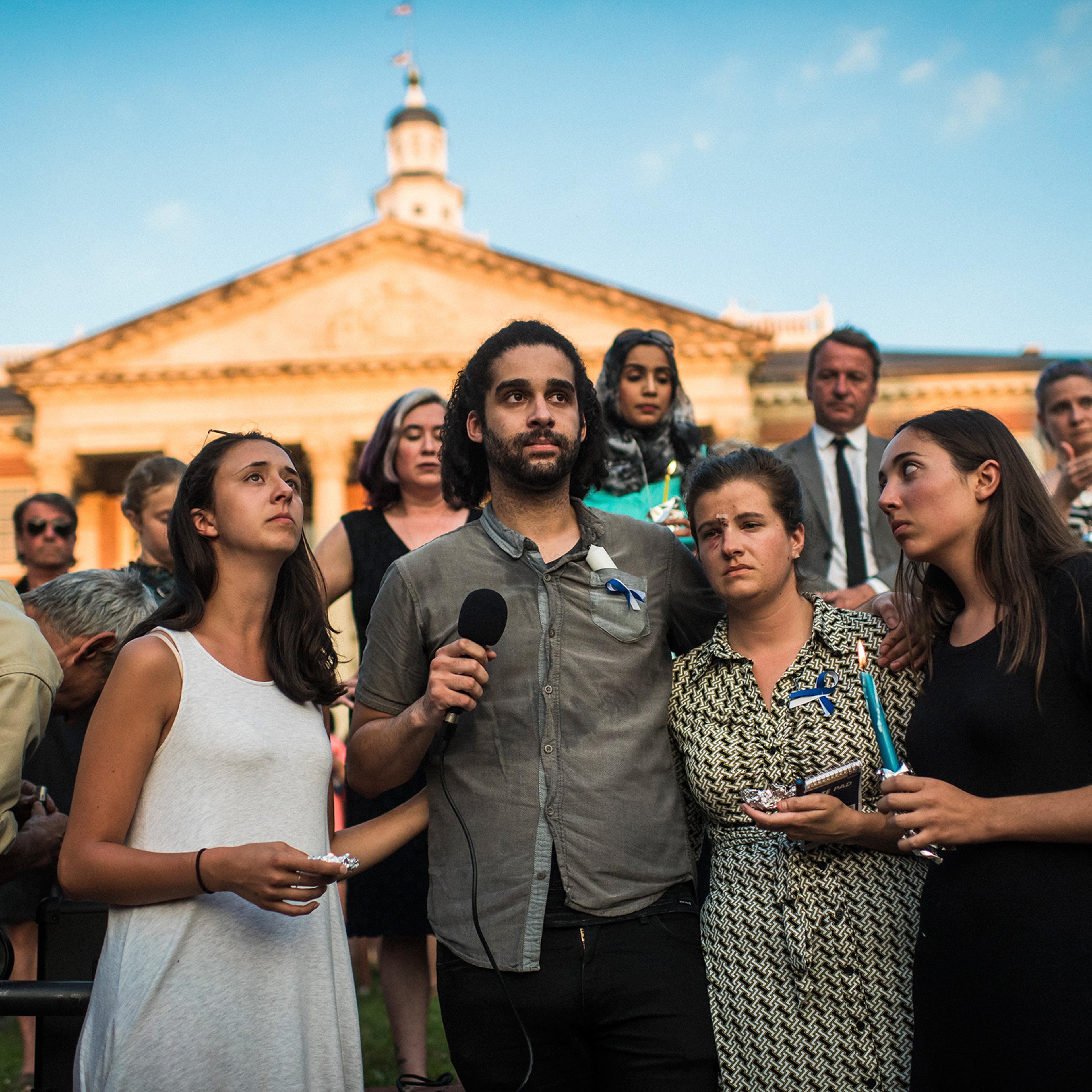 From left: Danielle Ohl, Phil Davis, Rachael Pacella and Selene San Felice—reporters at the Capital Gazette—address the crowd during a June 29, 2018, vigil for the victims of the newsroom shooting in Annapolis, Md.