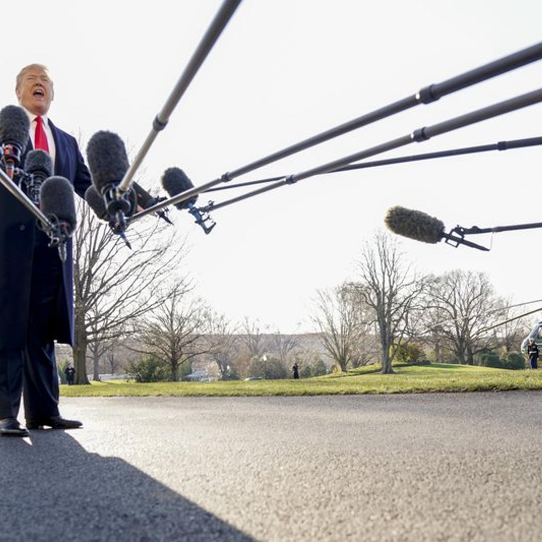 President Donald Trump speaks to reporters before boarding Marine One on the South Lawn of the White House in Washington on March 13, 2018.