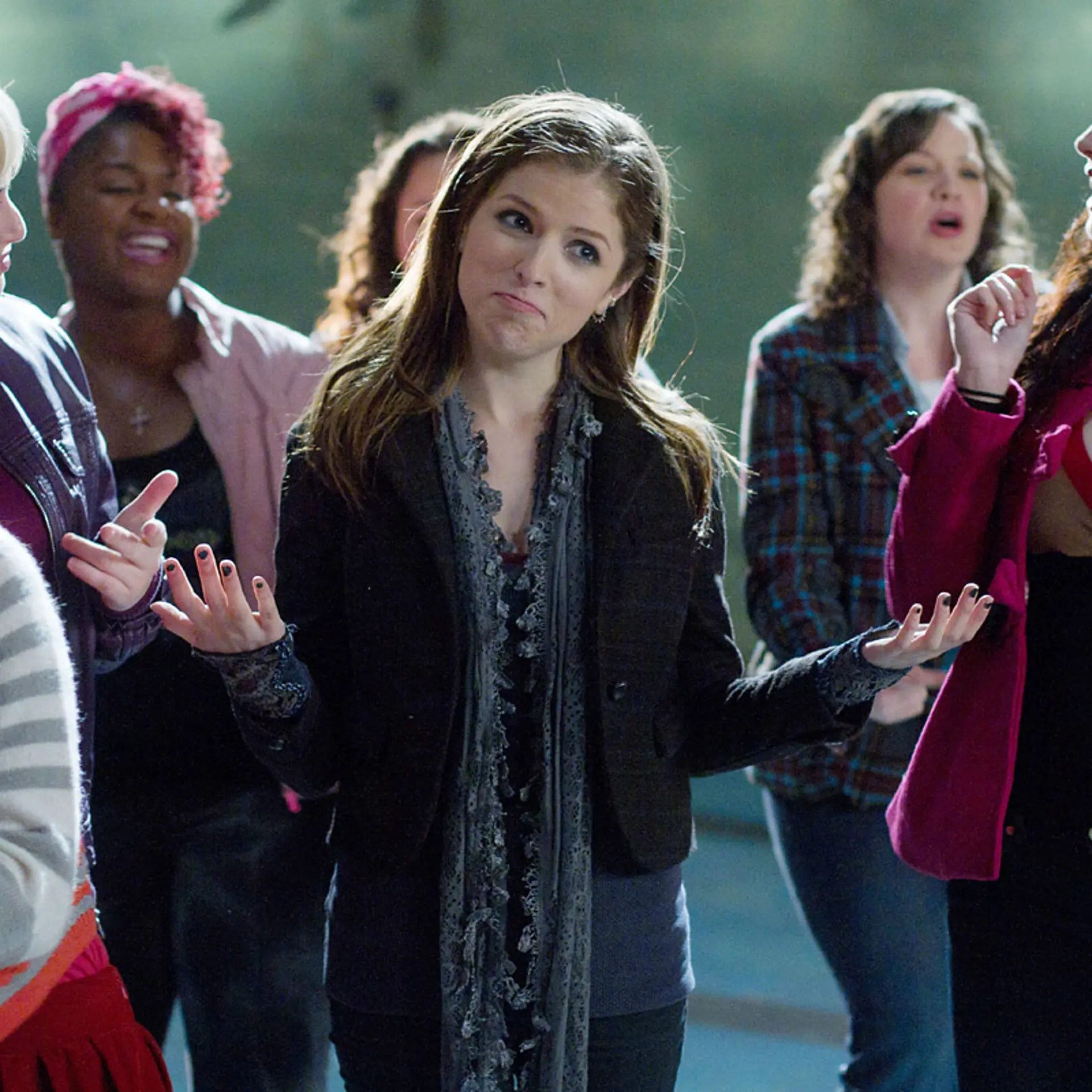 Hana Mae Lee (left), Rebel Wilson (blonde, left), Ester Dean (pink hair) and Anna Kendrick (center) in the hit a capella movie, "Pitch Perfect."