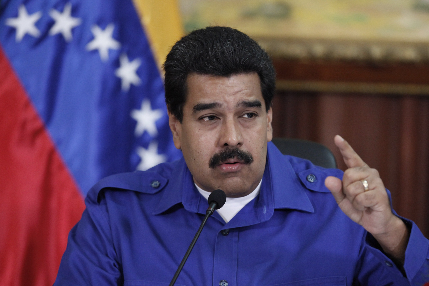 President Nicolas Maduro talks during a meeting with ministers at Miraflores Palace in Caracas, Sept. 3, 2014.
