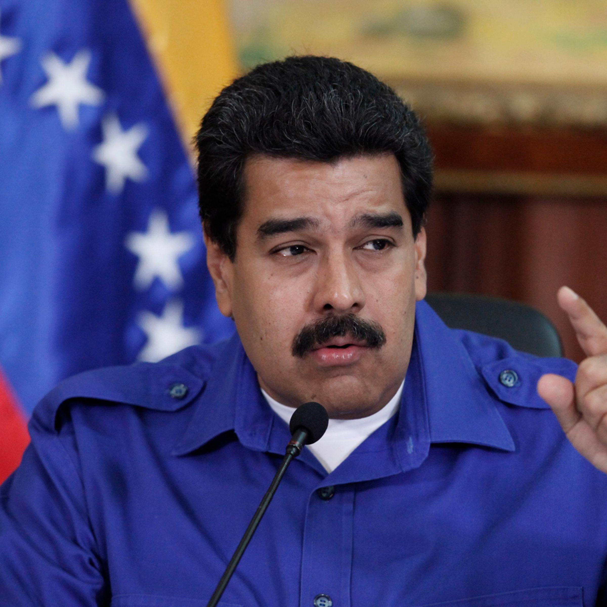 President Nicolas Maduro talks during a meeting with ministers at Miraflores Palace in Caracas, Sept. 3, 2014.
