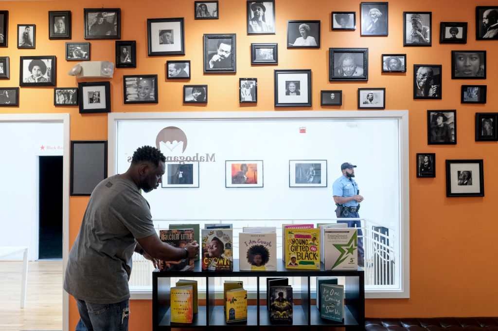 WASHINGTON, DC - APRIL 27: Derrick Young organizes books at Mah