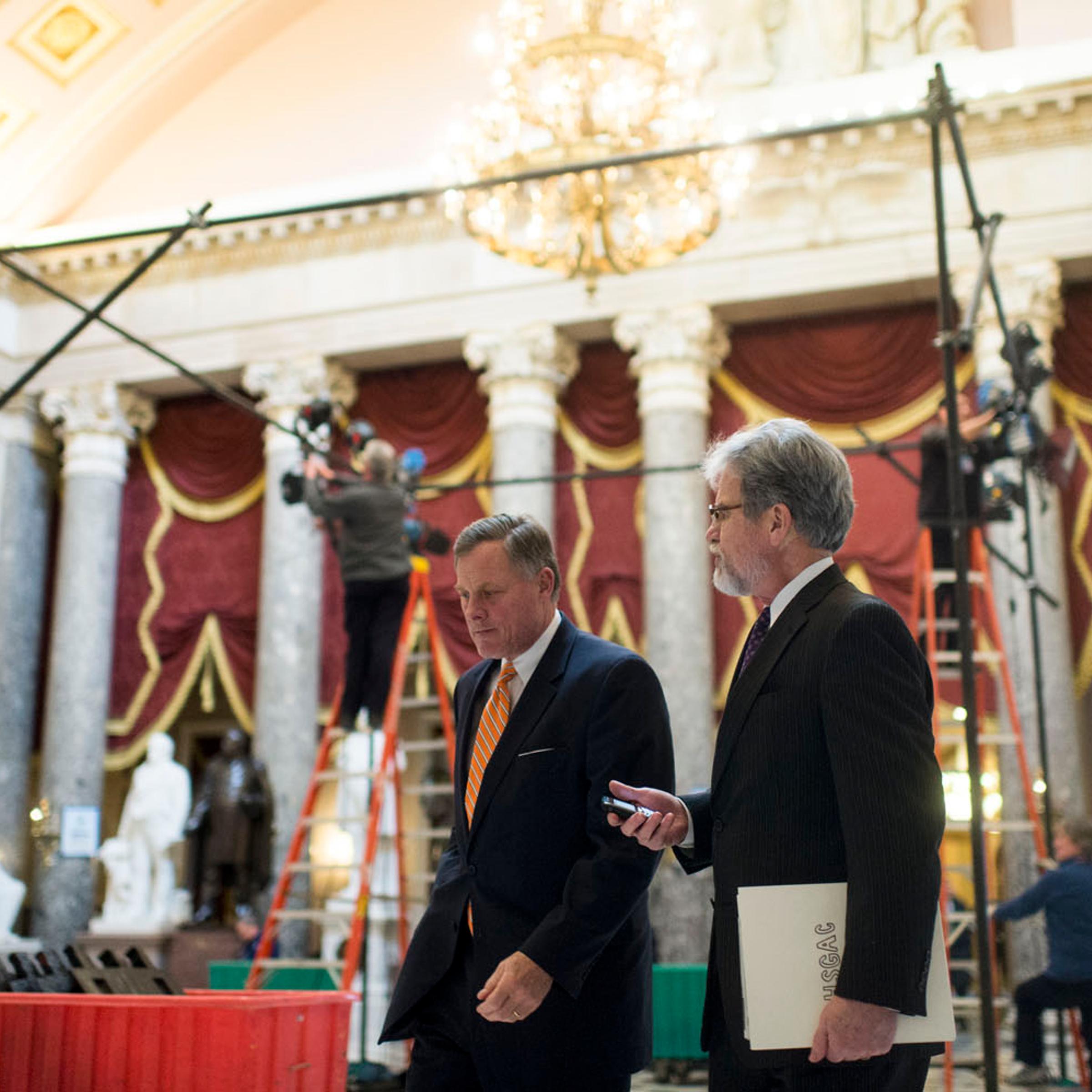 From left: Senator Richard Burr and Senator Tom Coburn walk through Statuary Hall in the Capitol ahead of the State of the Union on Jan. 28, 2014 in Washington, D.C.