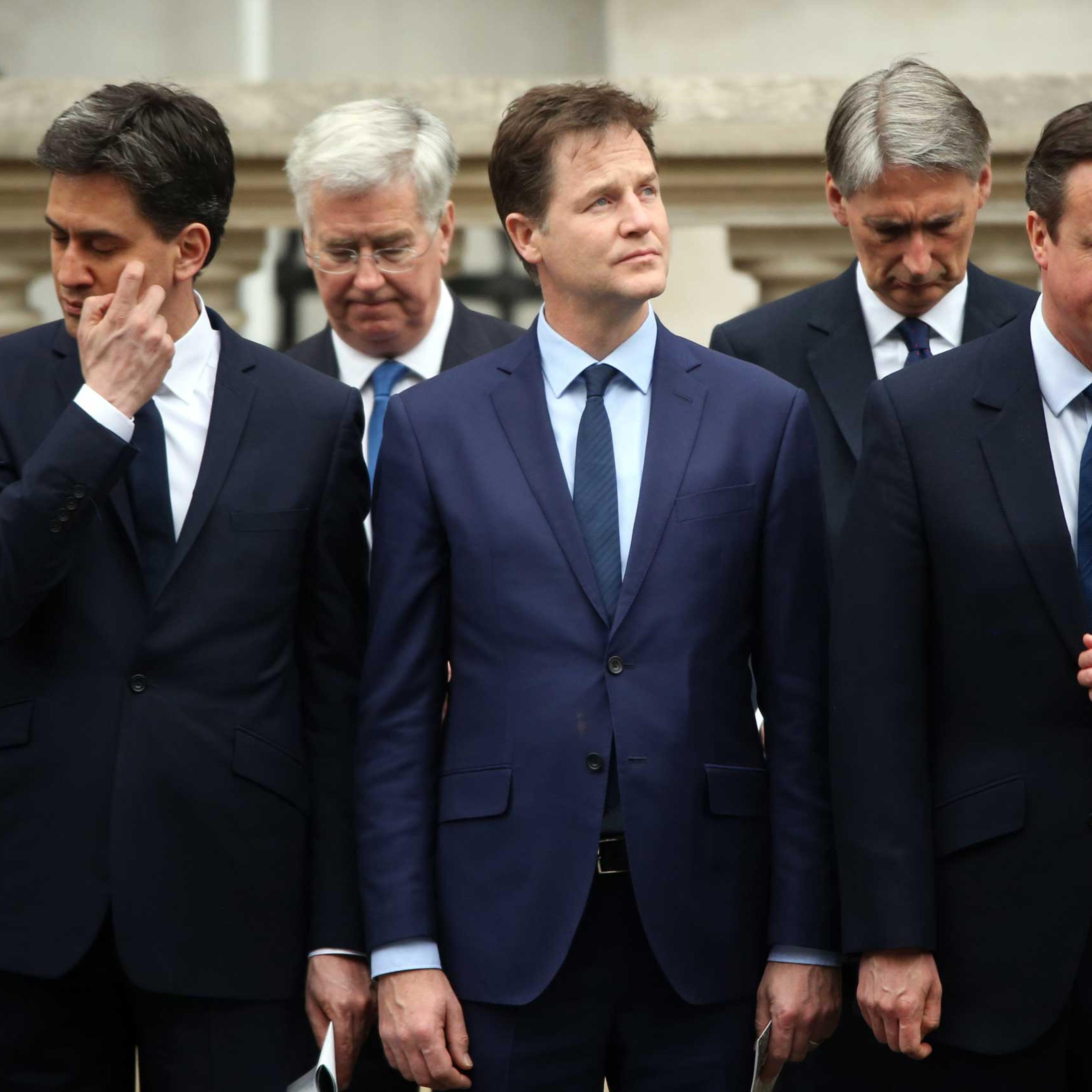 Labour Party leader Ed Miliband, Liberal Democrat leader Nick Clegg and Prime Minister David Cameron stand during a tribute at the Cenotaph to begin three days of national commemorations to mark the 70th anniversary of VE Day on May 8, 2015 in London.