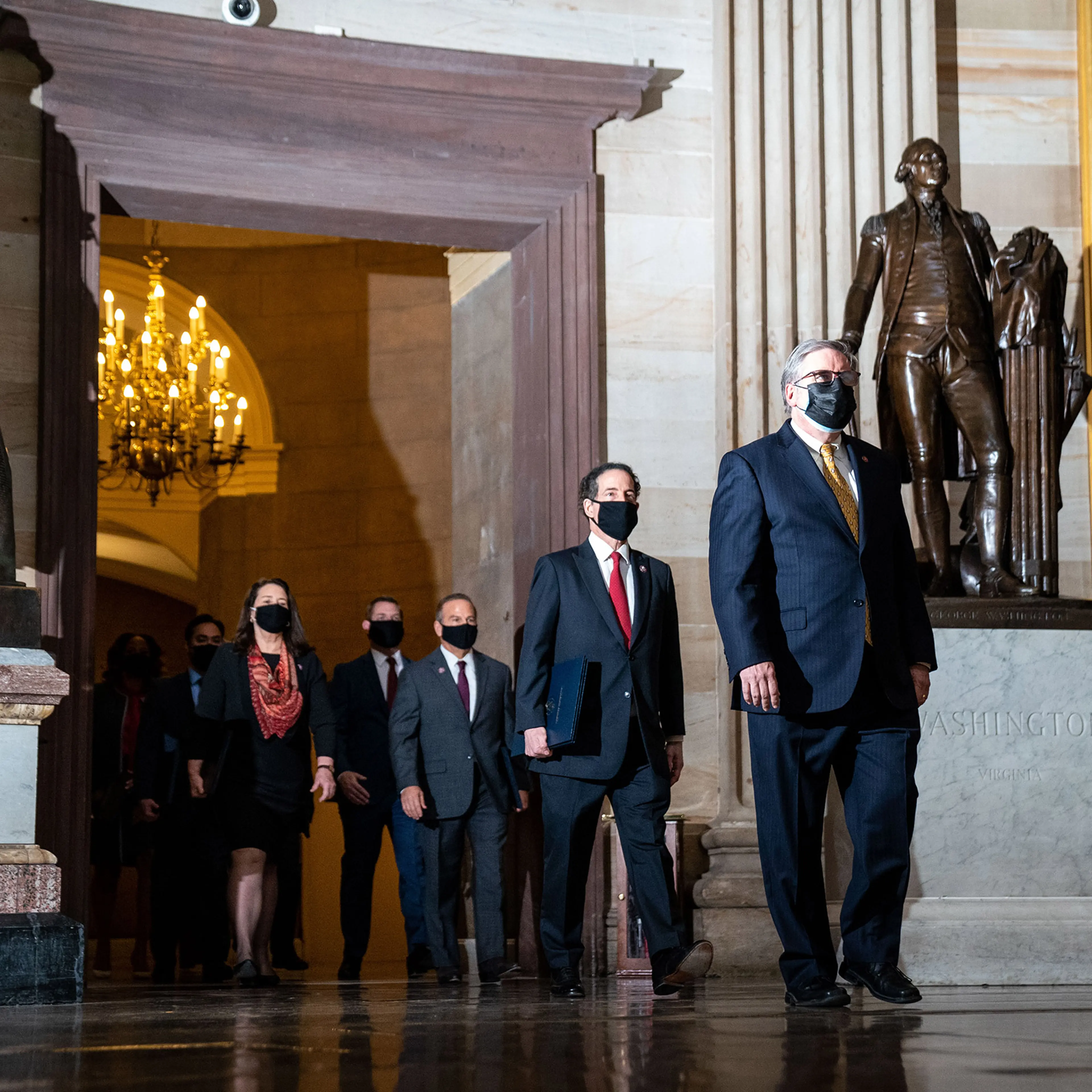 House impeachment managers, lead by Rep. Jamie Raskin, walk through the Rotunda of the U.S. Capitol in Washington on Feb. 9, 2021.