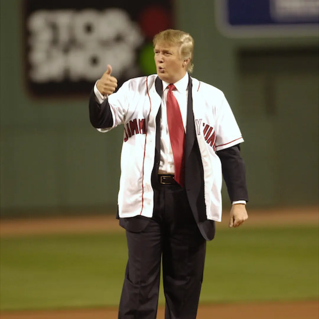 Donald Trump gives a thumbs-up sign after throwing out the c