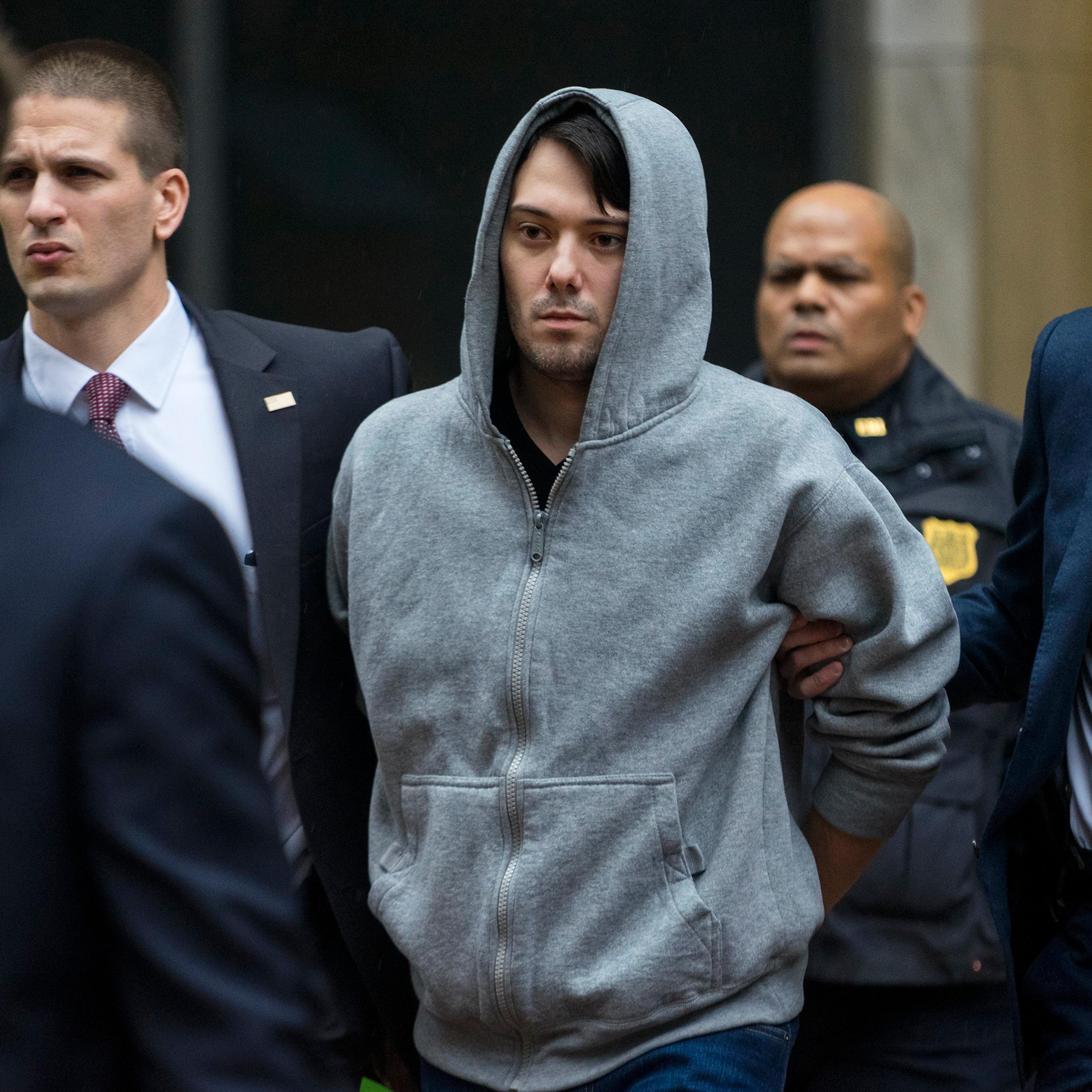 Martin Shkreli, the former hedge fund manager under fire for buying a pharmaceutical company and ratcheting up the price of a life-saving drug, is escorted by law enforcement agents in New York on Dec. 17, 2015.
