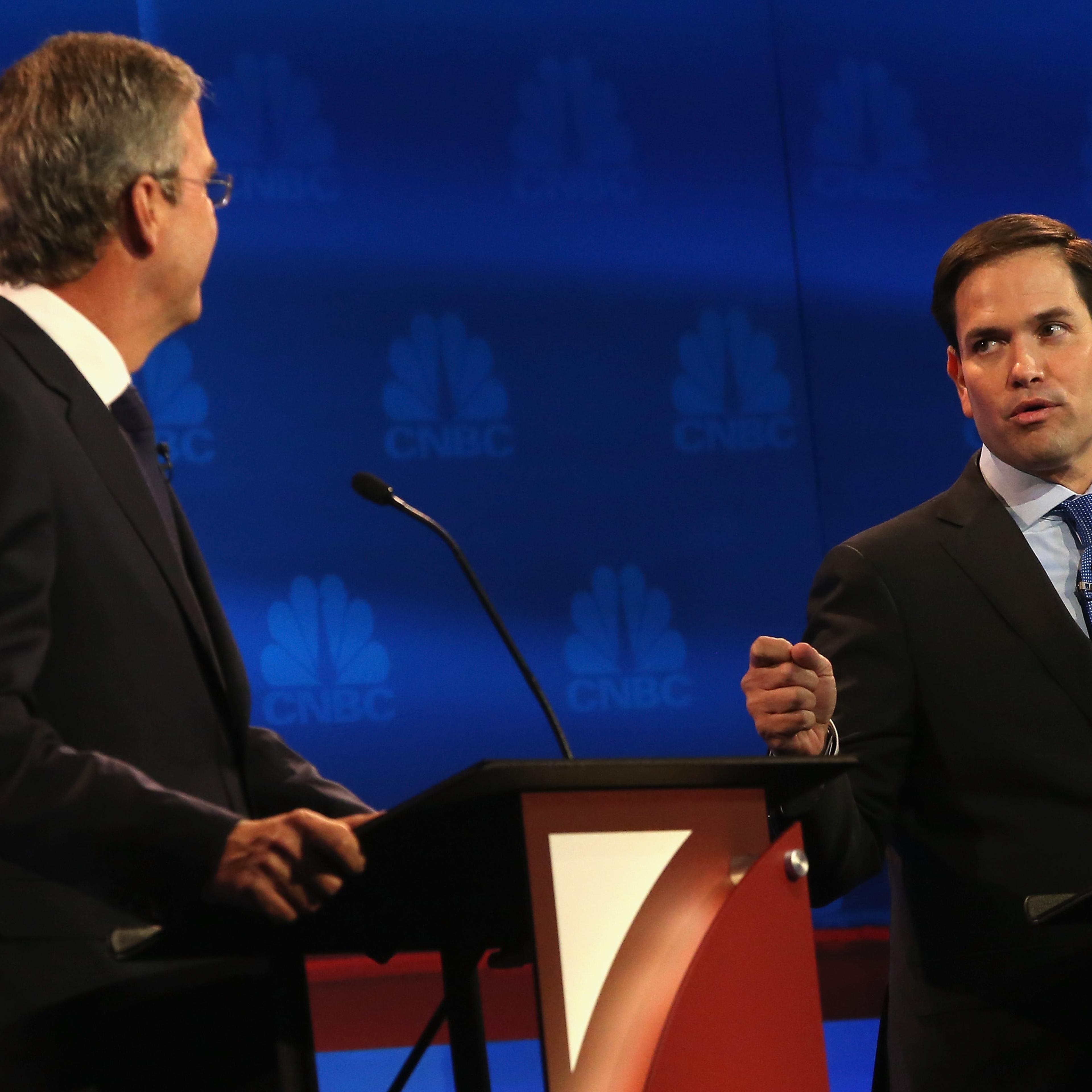 Presidential candidates Sen. Marco Rubio (R) (R-FL) speaks while Jeb Bush looks on during the CNBC Republican Presidential Debate in Boulder, Colorado on Oct. 28, 2015 .
