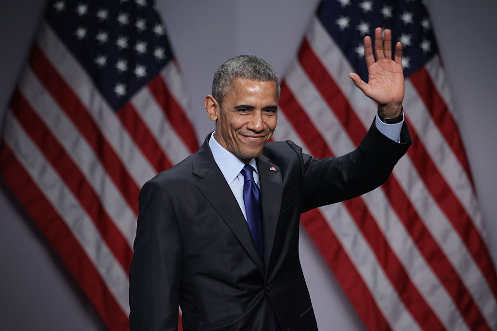 U.S. President Barack Obama waves after he spoke during the SelectUSA Investment Summit March 23, 2015 in National Harbor, Maryland.