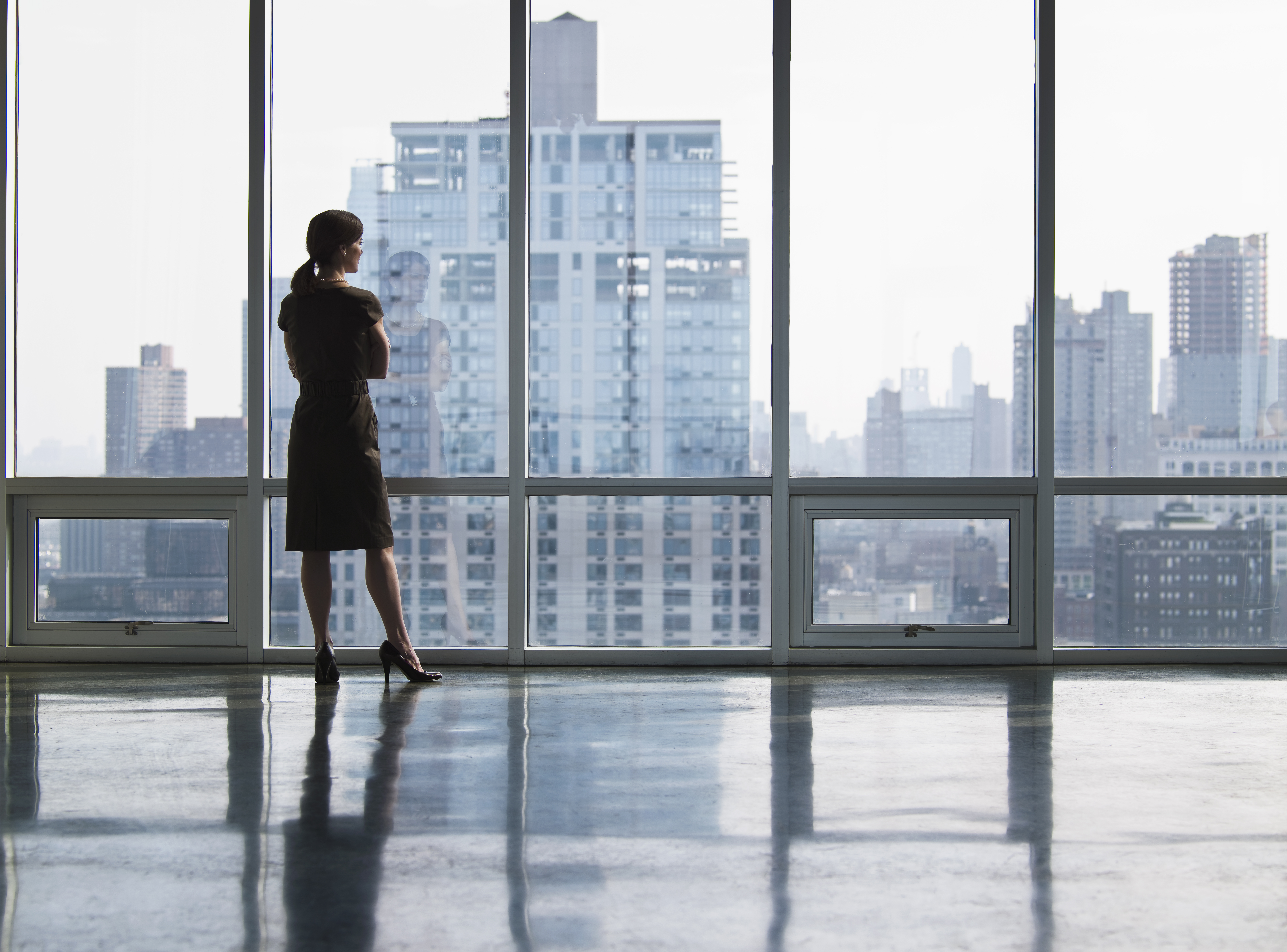 business-woman-looking-out-window