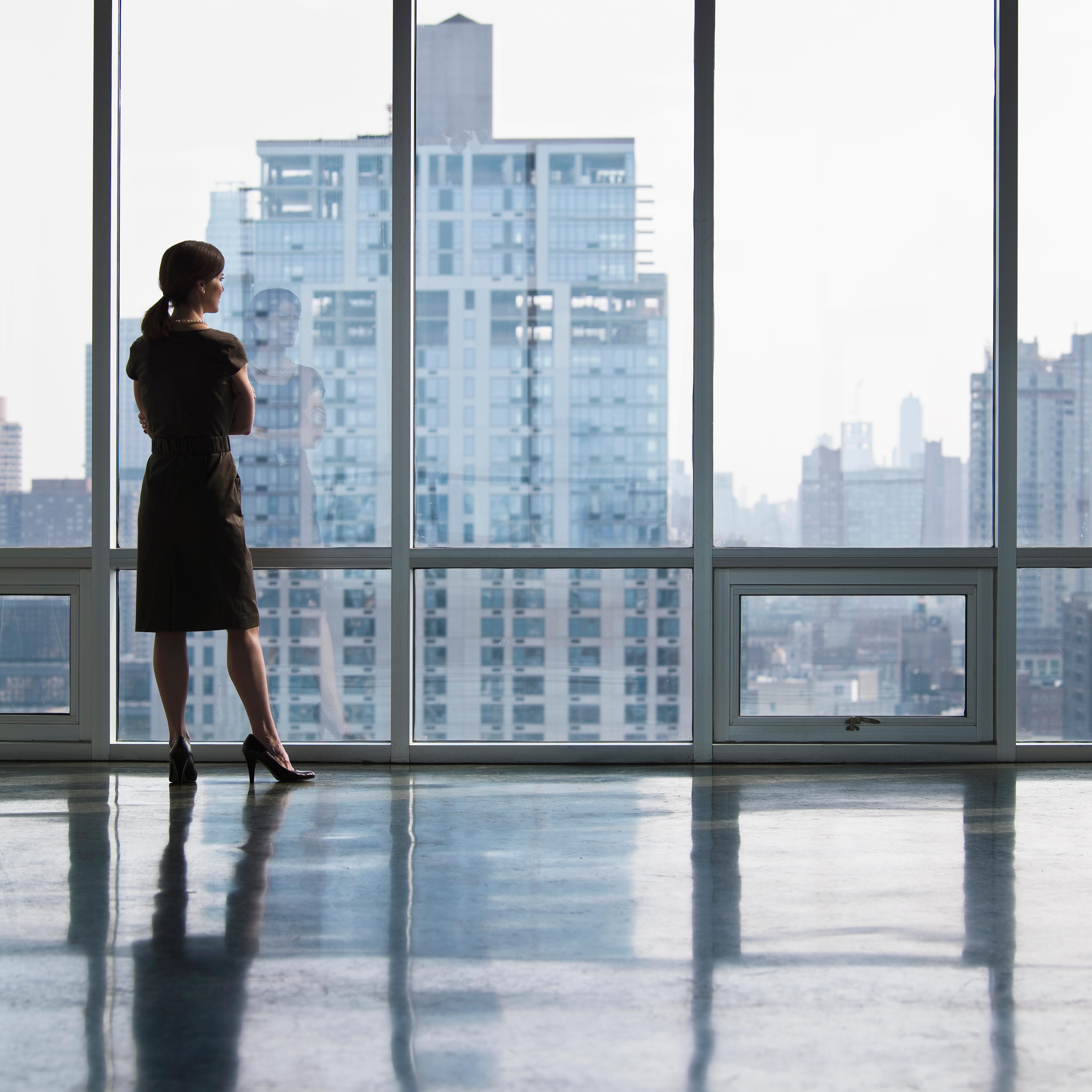 business-woman-looking-out-window