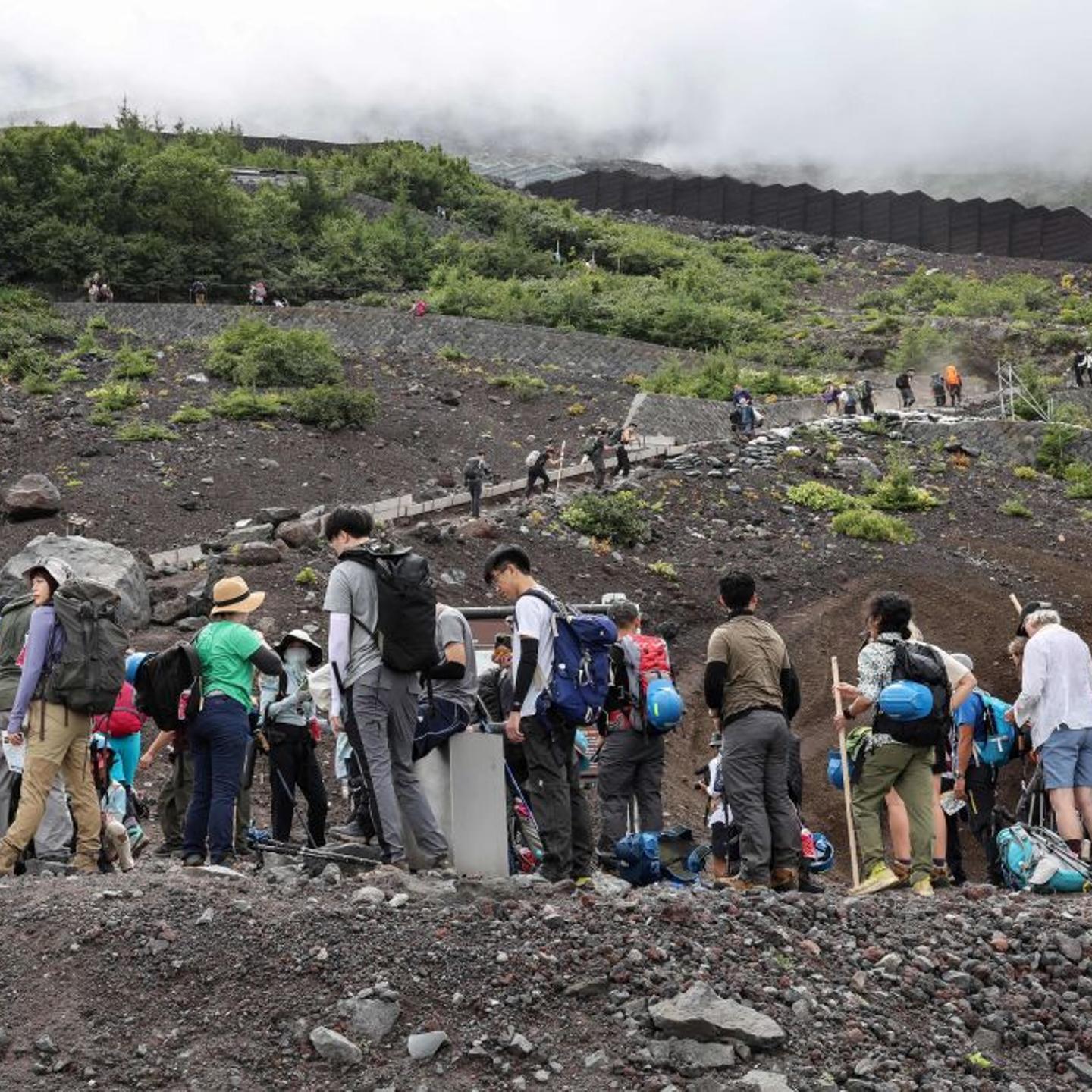 This photo taken on Aug. 31, 2023 shows visitors climbing the slopes of Mount Fuji, Japan's highest peak at 3,776 m.
