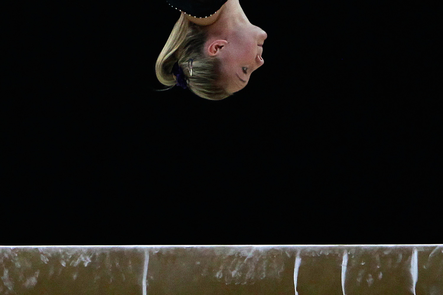 January 9, 2012. A gymnast practises on the beam during a training session before the Olympic gymnastics venue test event in east London.