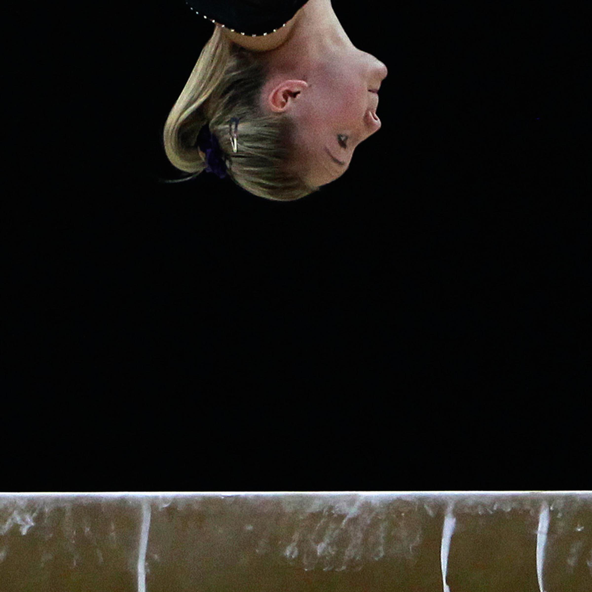 January 9, 2012. A gymnast practises on the beam during a training session before the Olympic gymnastics venue test event in east London.