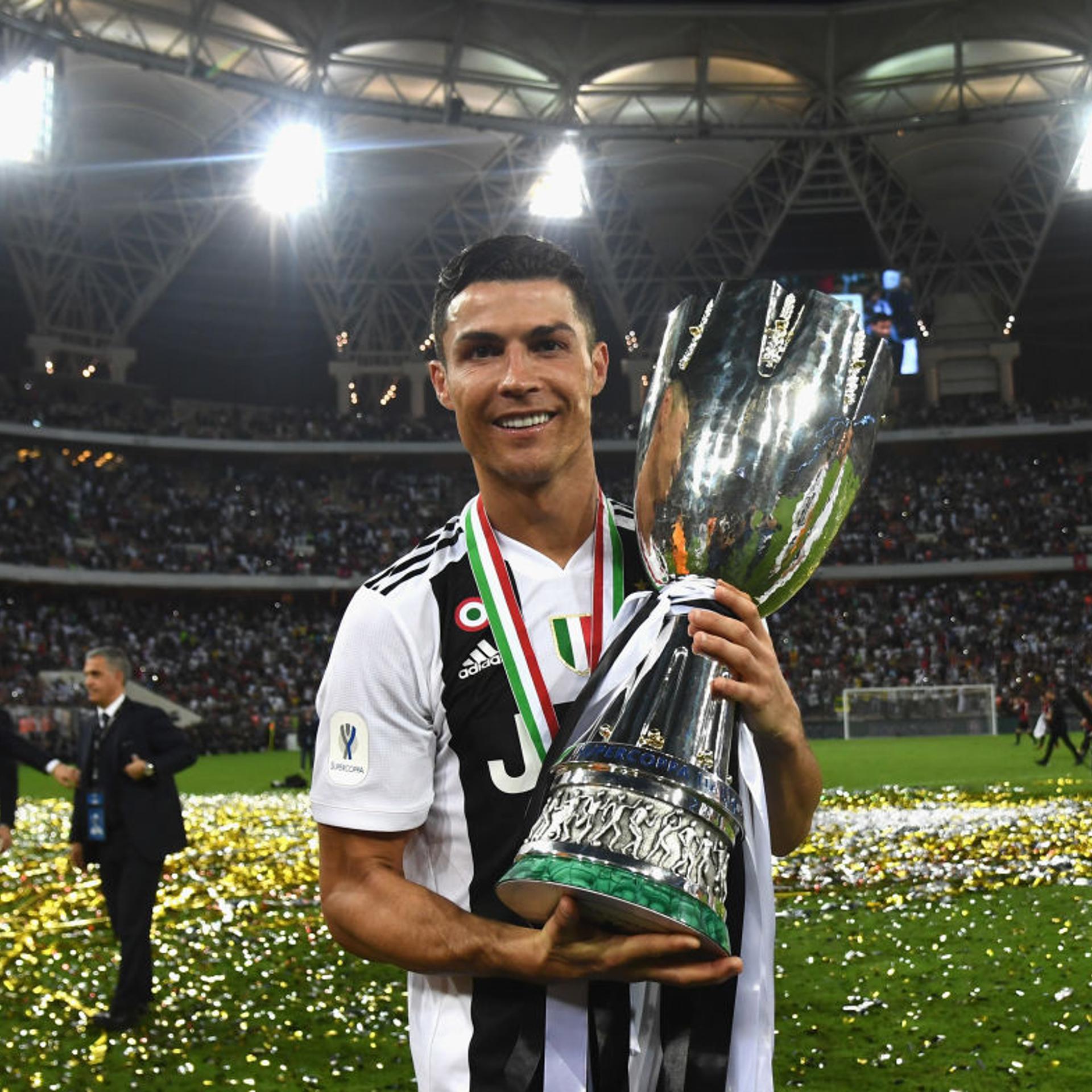 Cristiano Ronaldo of Juventus holds the Italian supercup trophy after winning the match agains AC Milan