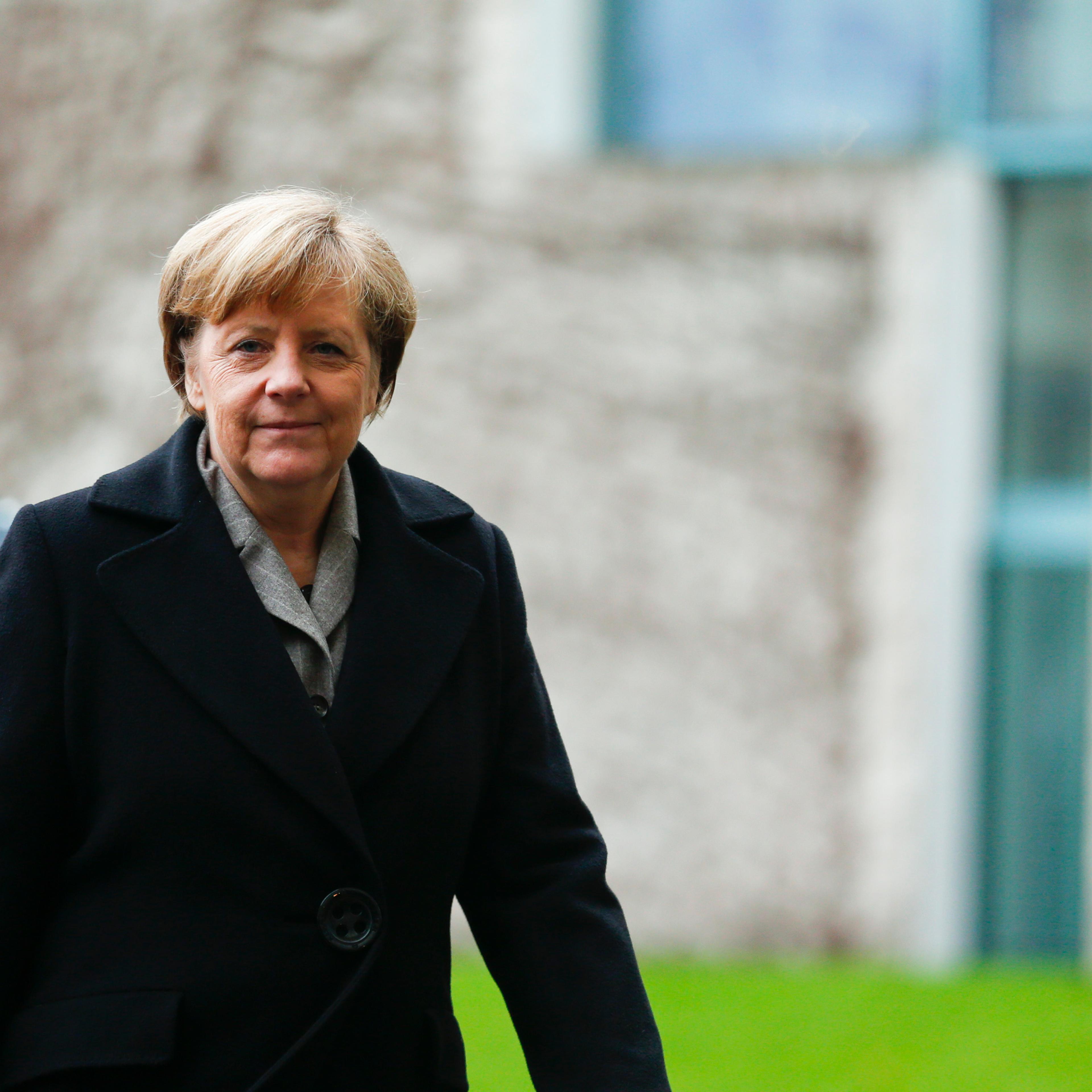 German Chancellor Merkel arrives to attend a welcoming ceremony for Turkish Prime Minister Davutoglu in Berlin