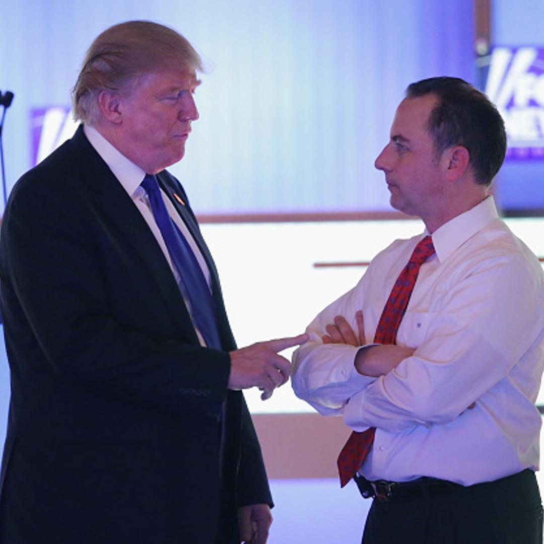 Republican presidential candidate Donald Trump (L) speaks with Reince Priebus, chairman of the Republican National Committee, at a debate sponsored by Fox News at the Fox Theatre on March 3, 2016 in Detroit, Michigan.