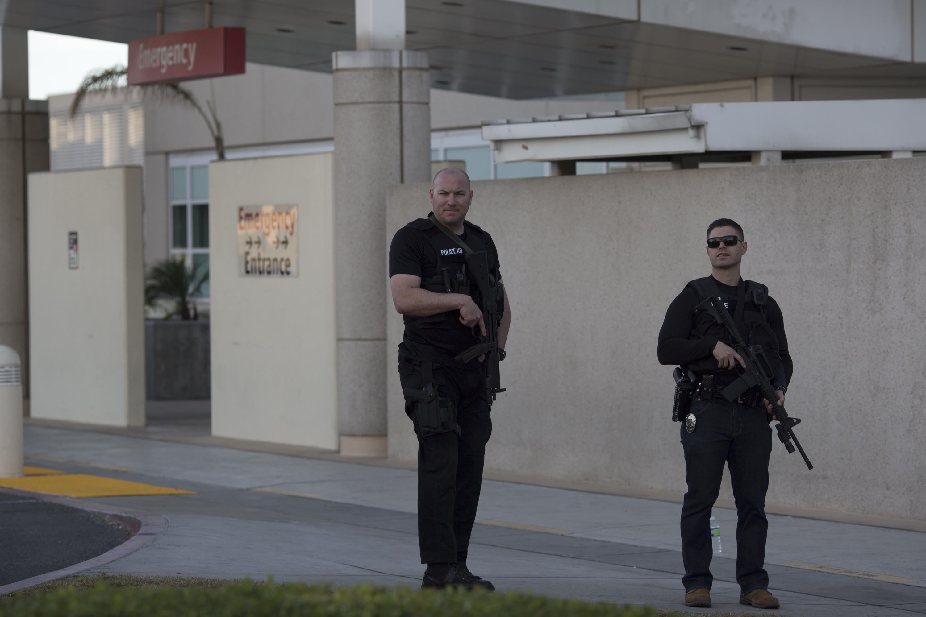 Police officers guard the emergency entrance at Arrowhead Regional Medical Center where numerous victims of a mass shooting at the Inland Regional Center were admitted on December 2, 2015 in San Bernardino, California.