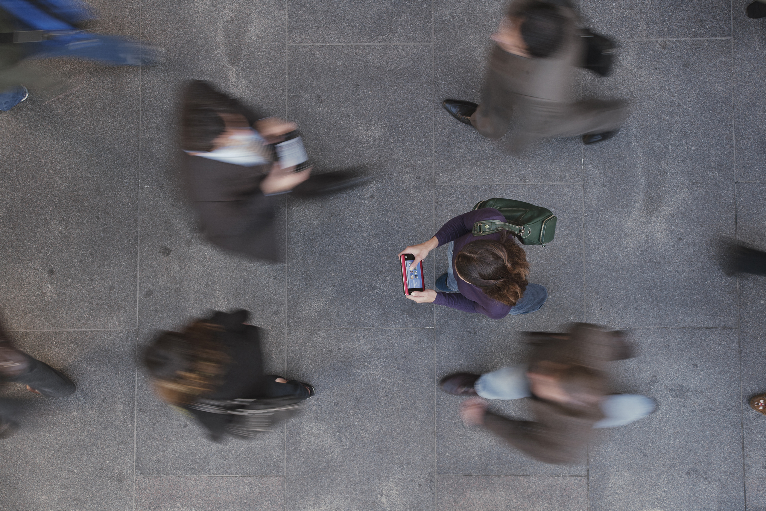 Group with electronic devices in the street