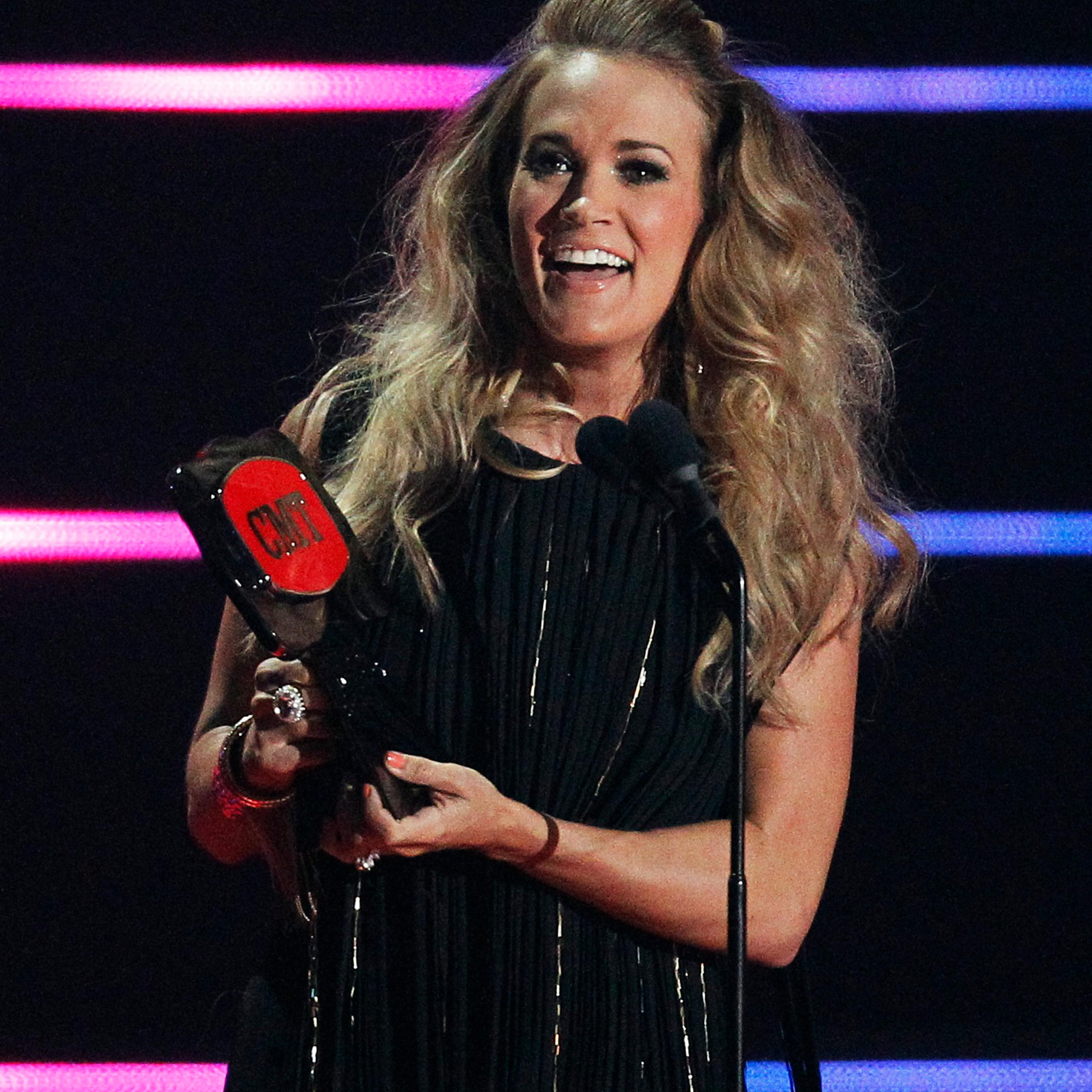 Carrie Underwood accepts Video Of The Year Award during the 2014 CMT Music Awards in Nashville