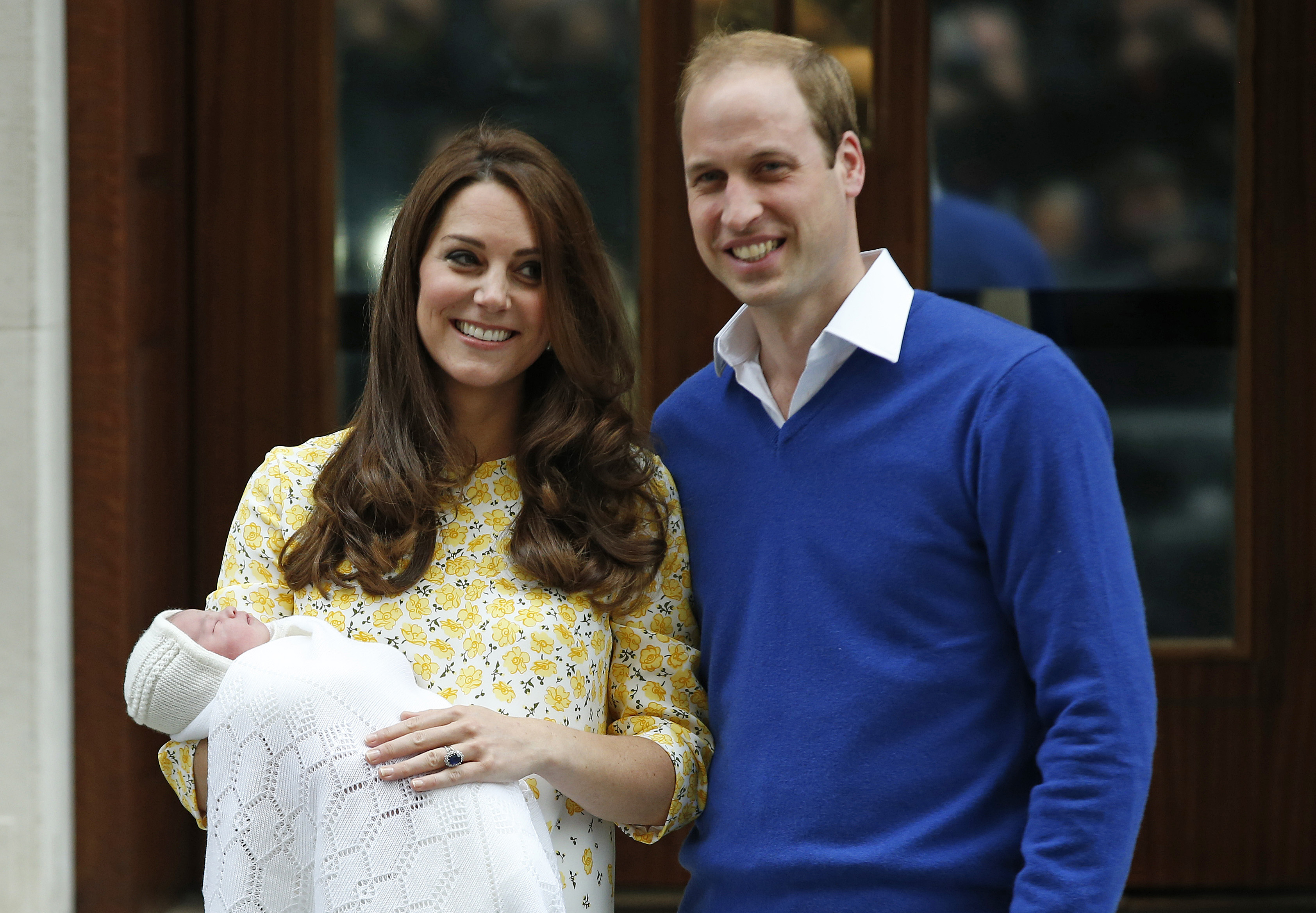 Britain's Prince William and Kate, Duchess of Cambridge and their newborn baby princess, pose for the media as they leave St. Mary's Hospital's exclusive Lindo Wing, London