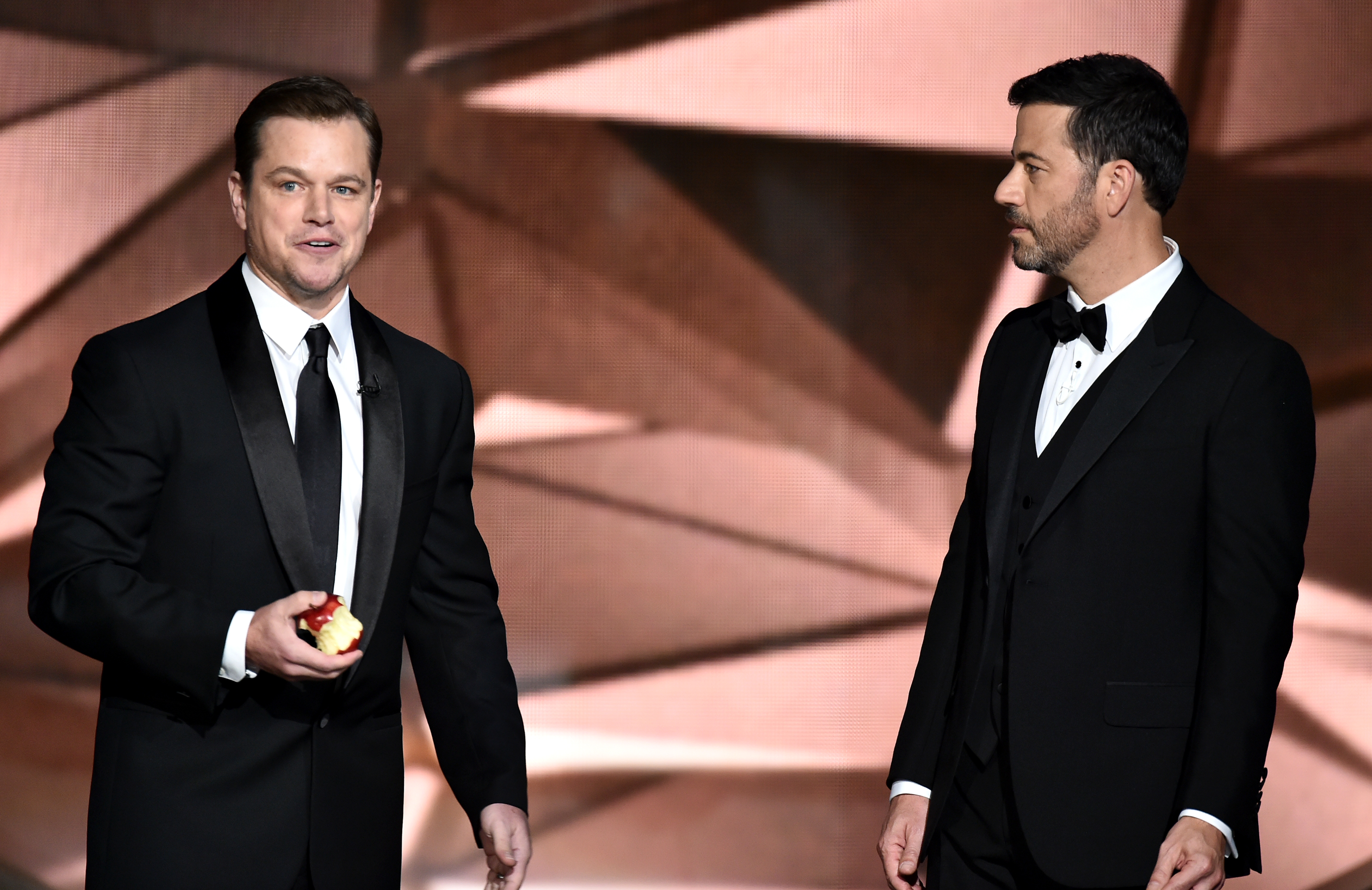 Matt Damon, left, and Jimmy Kimmel speak at the 68th Primetime Emmy Awards on Sept. 18, 2016 in Los Angeles.