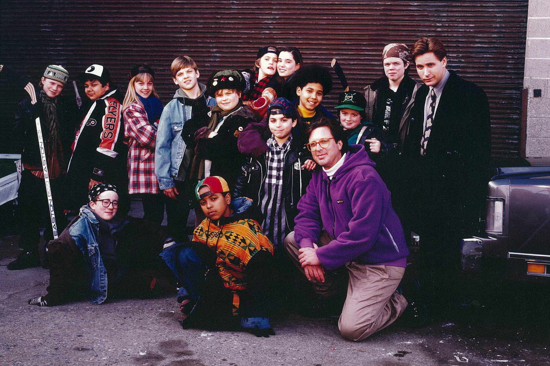 The cast of the first 'Mighty Ducks' films with producer Jordan Kerner (kneeling).