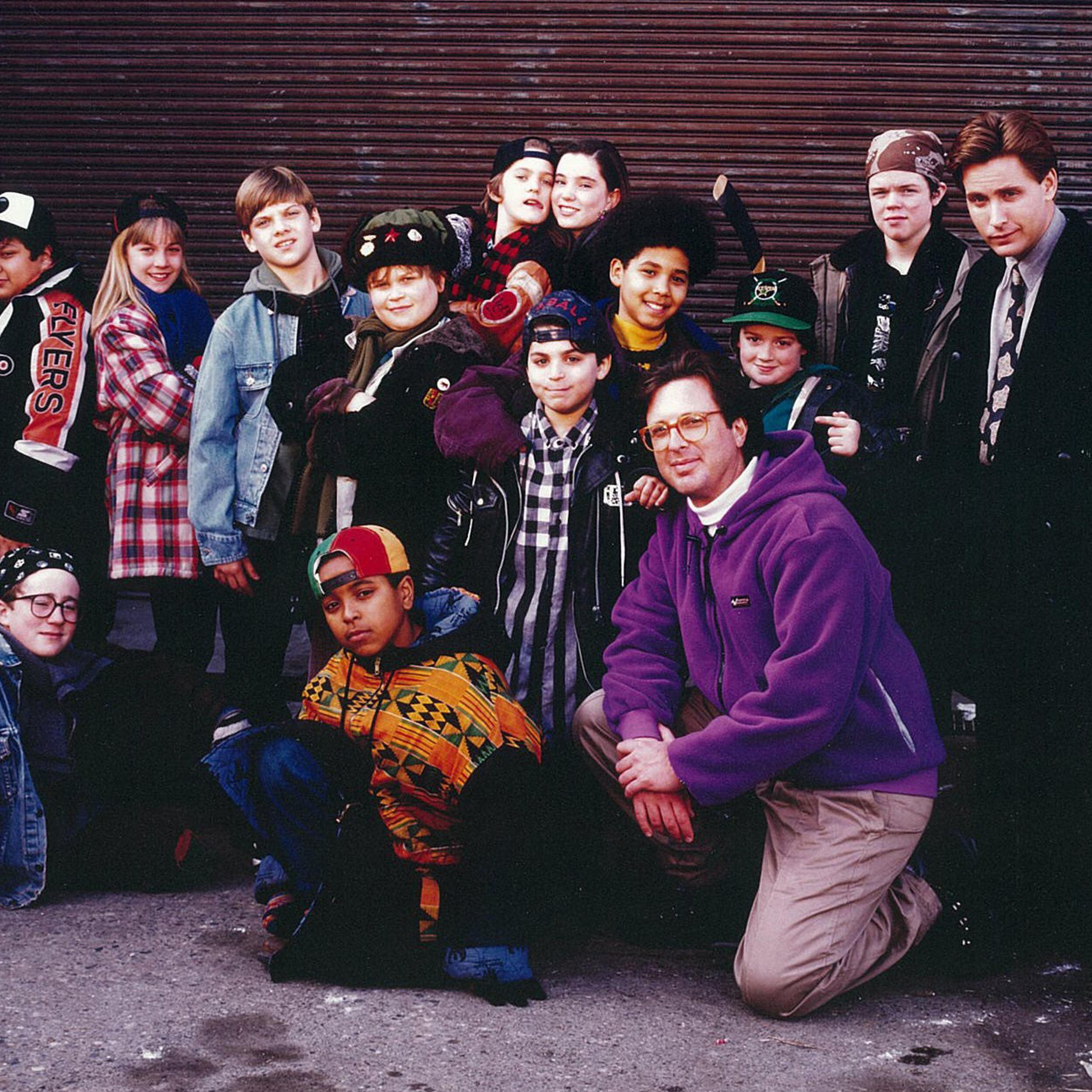 The cast of the first 'Mighty Ducks' films with producer Jordan Kerner (kneeling).