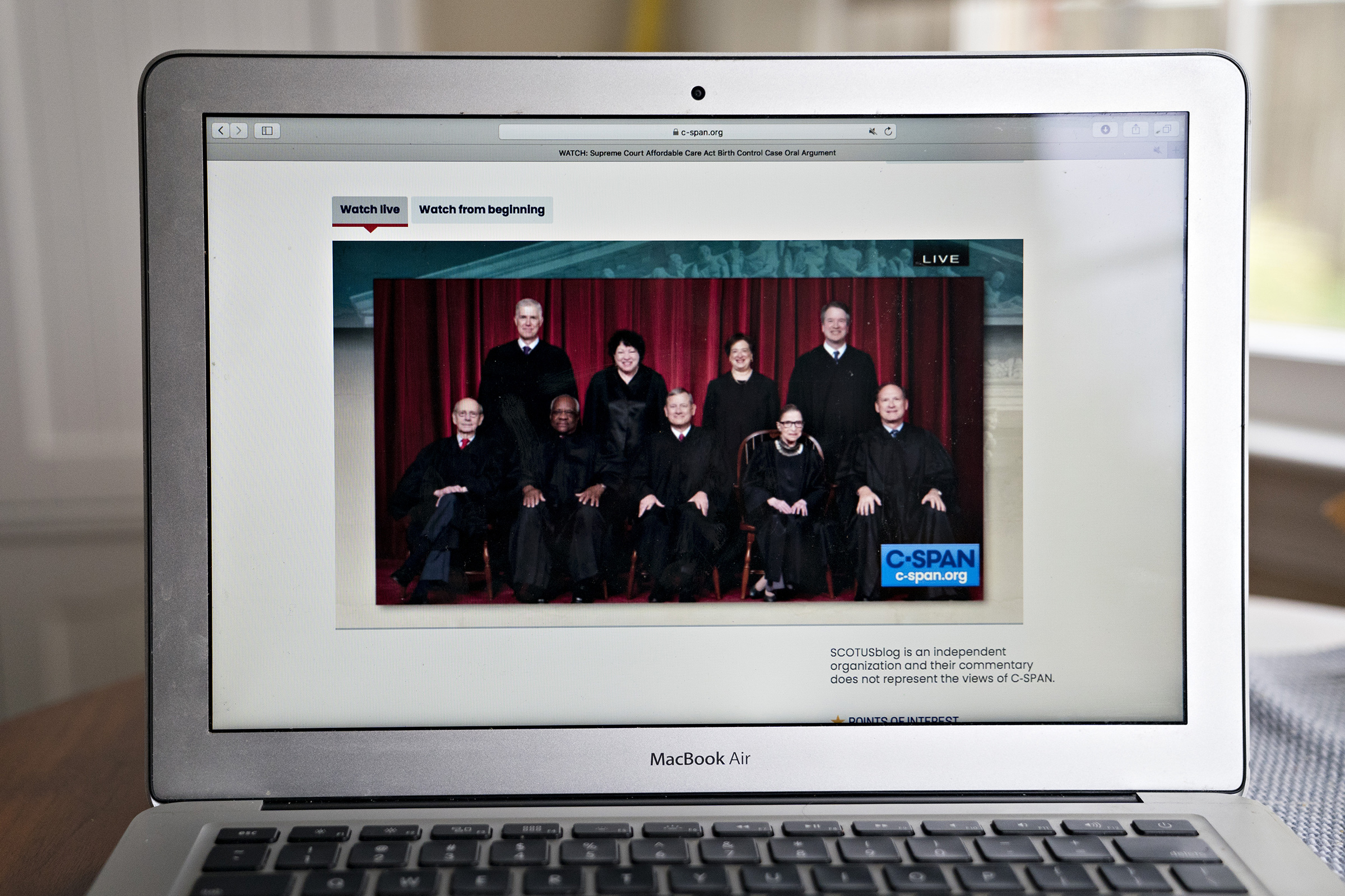 Justices of the U.S. Supreme Court are displayed on a laptop computer during oral arguments before the Supreme Court in Little Sisters of the Poor v. Pennsylvania in an arranged photograph taken in Arlington, Virginia, on May 6