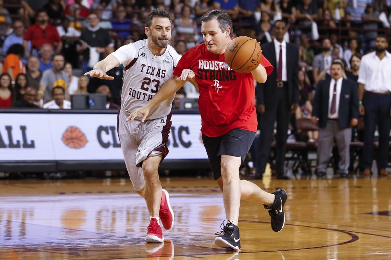Senator Ted Cruz dribbles past Jimmy Kimmel during the Blobfish Basketball Classic and one-on-one interview at Texas Southern University’s Health &amp; Physical Education Arena in in Houston on Saturday, June 16, 2018.
