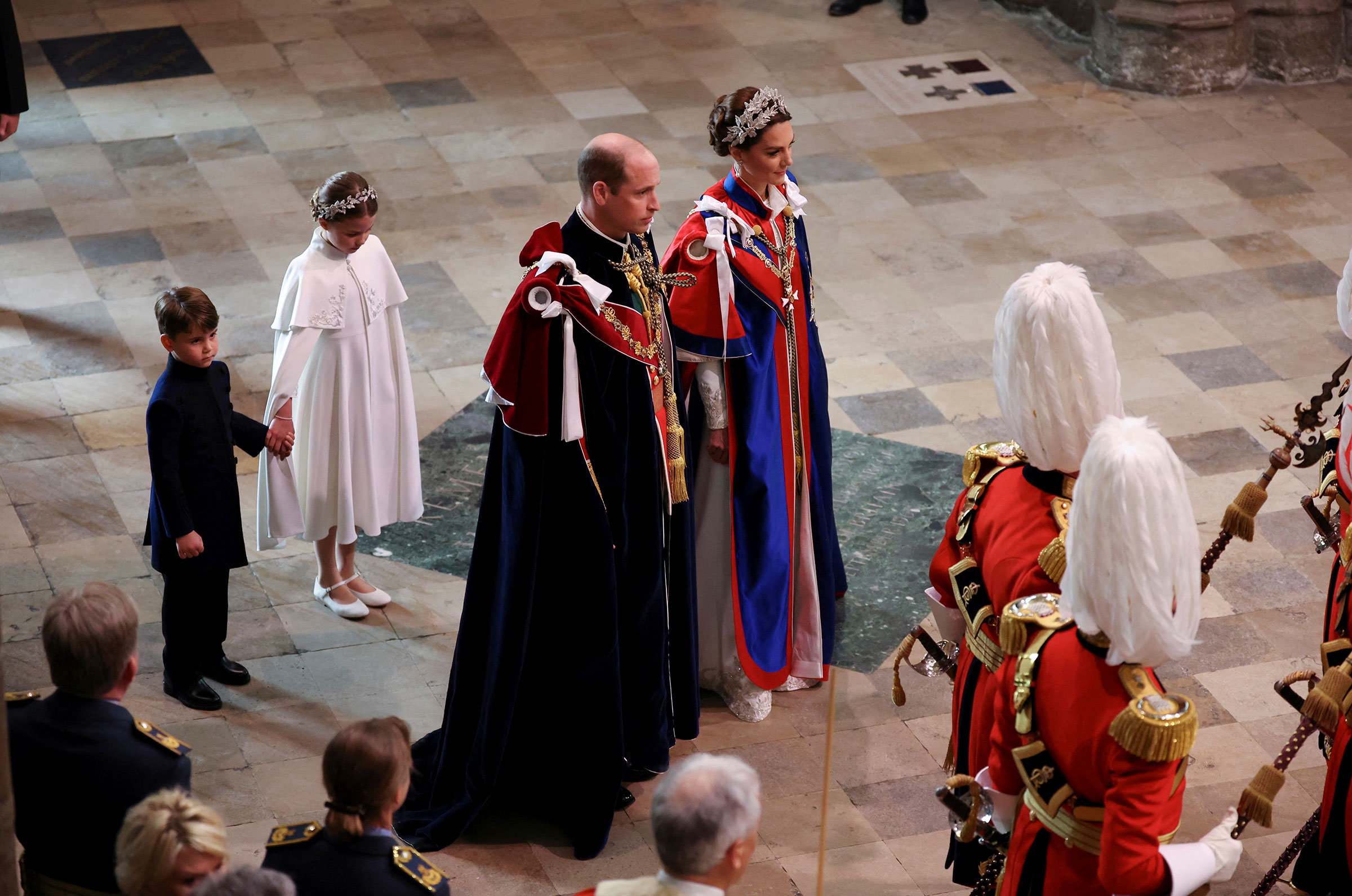 Prince George, Princess Charlotte, and the Prince and Princess of Wales arriving at the coronation of King Charles III
