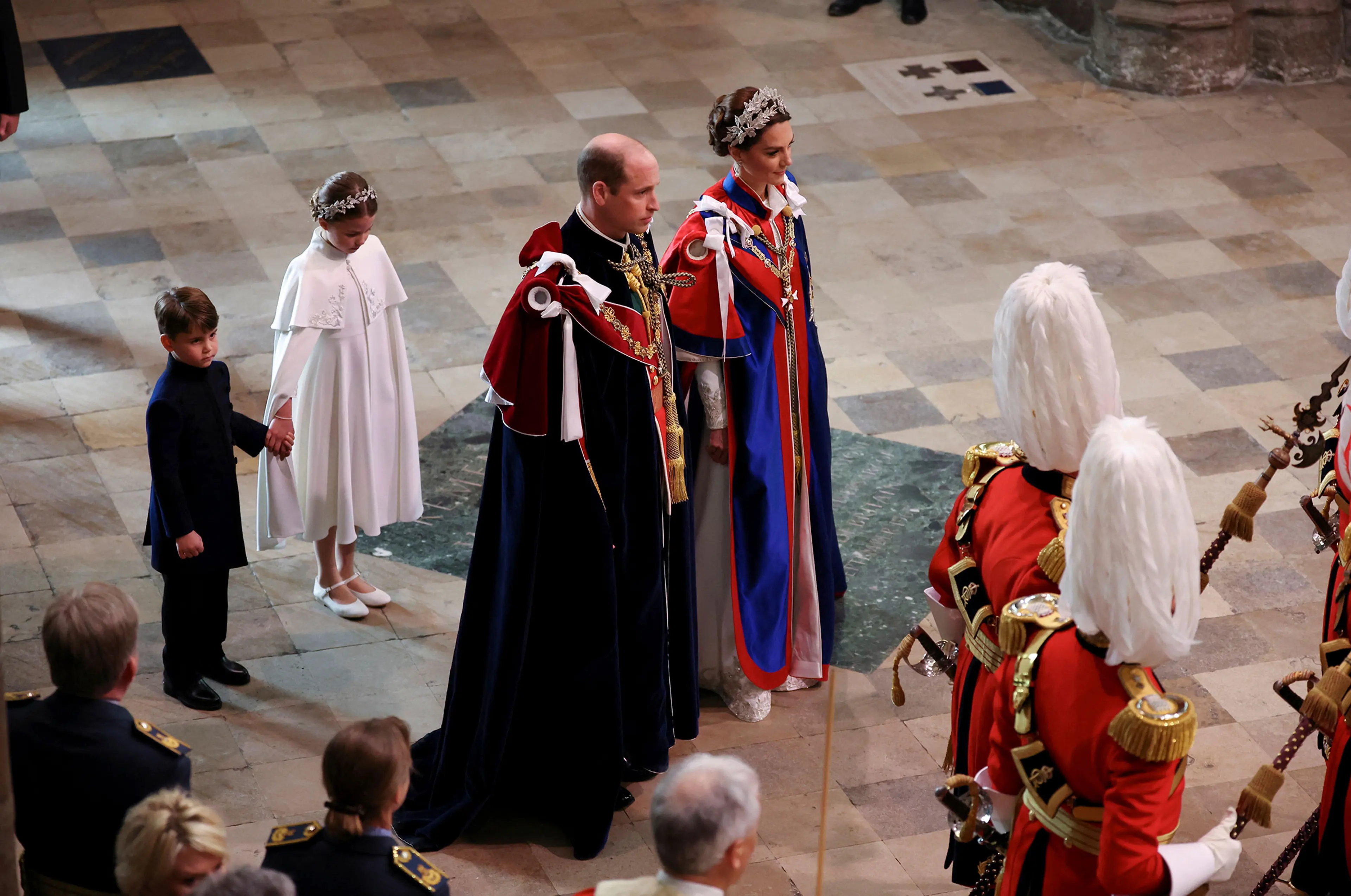 Prince George, Princess Charlotte, and the Prince and Princess of Wales arriving at the coronation of King Charles III