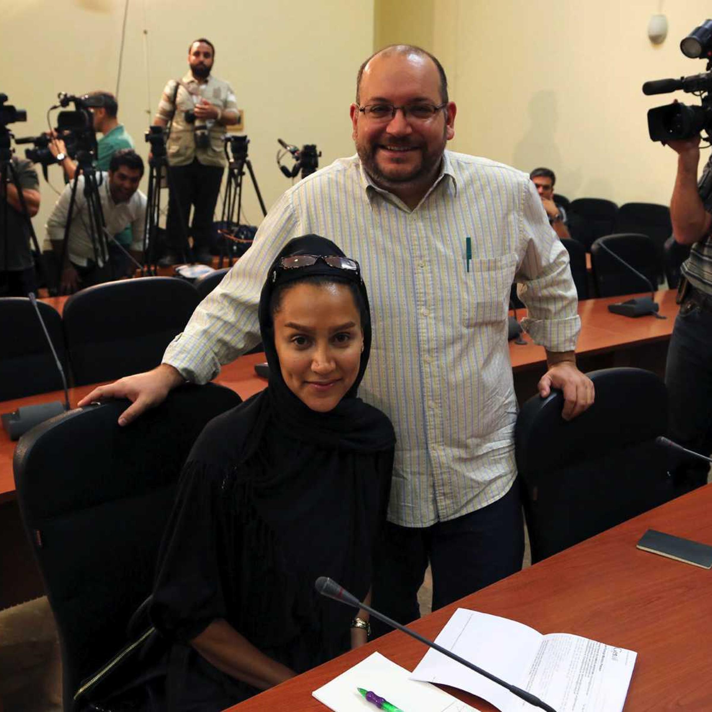 Washington <i>Post</i> Iranian-American journalist Jason Rezaian, right, and his Iranian wife Yeganeh Salehi, who works for the the <i>National</i>, an UAE newspaper, during a Foreign Ministry weekly press conference in Tehran on Sept. 10, 2013