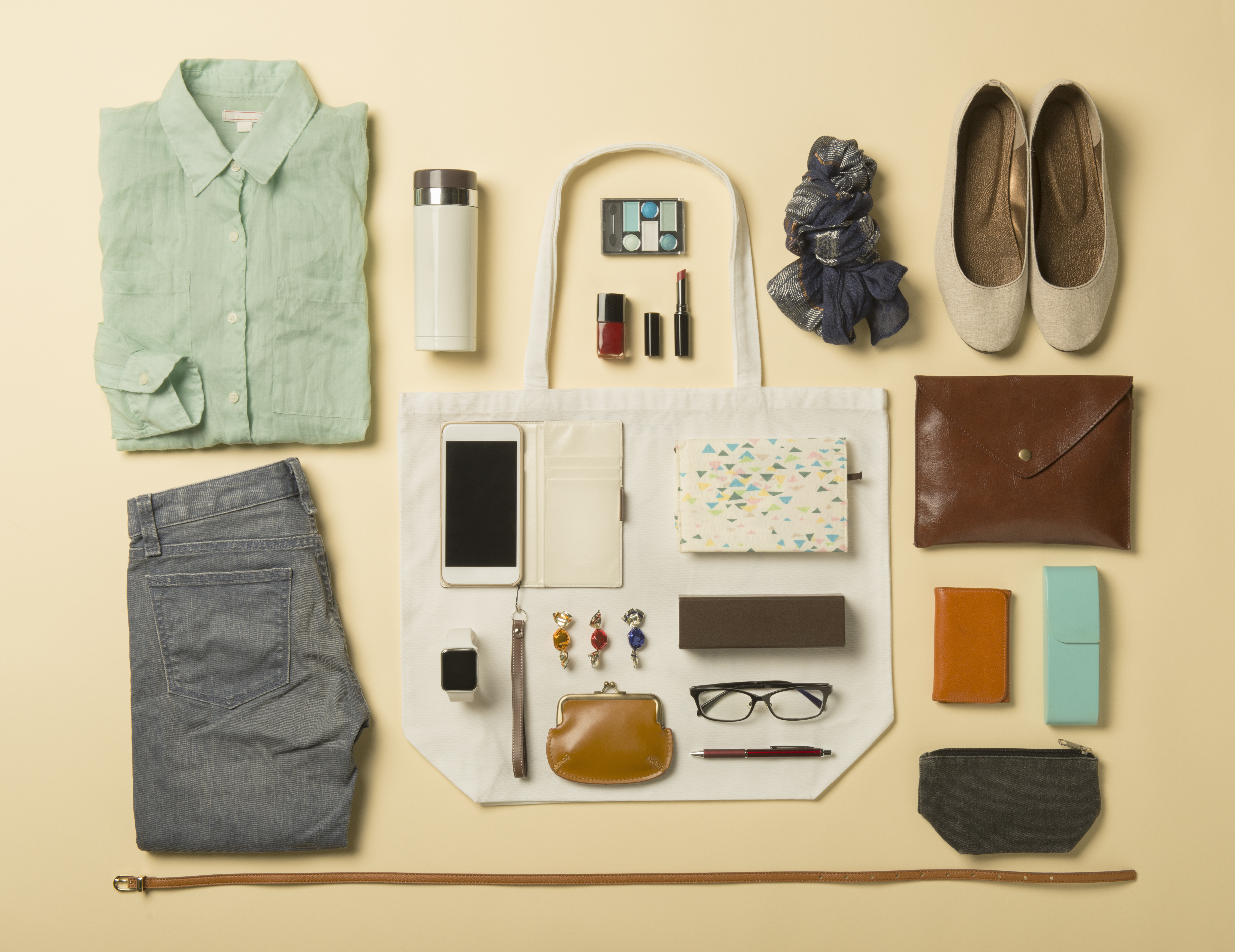 Woman daily supplies shot knolling style.