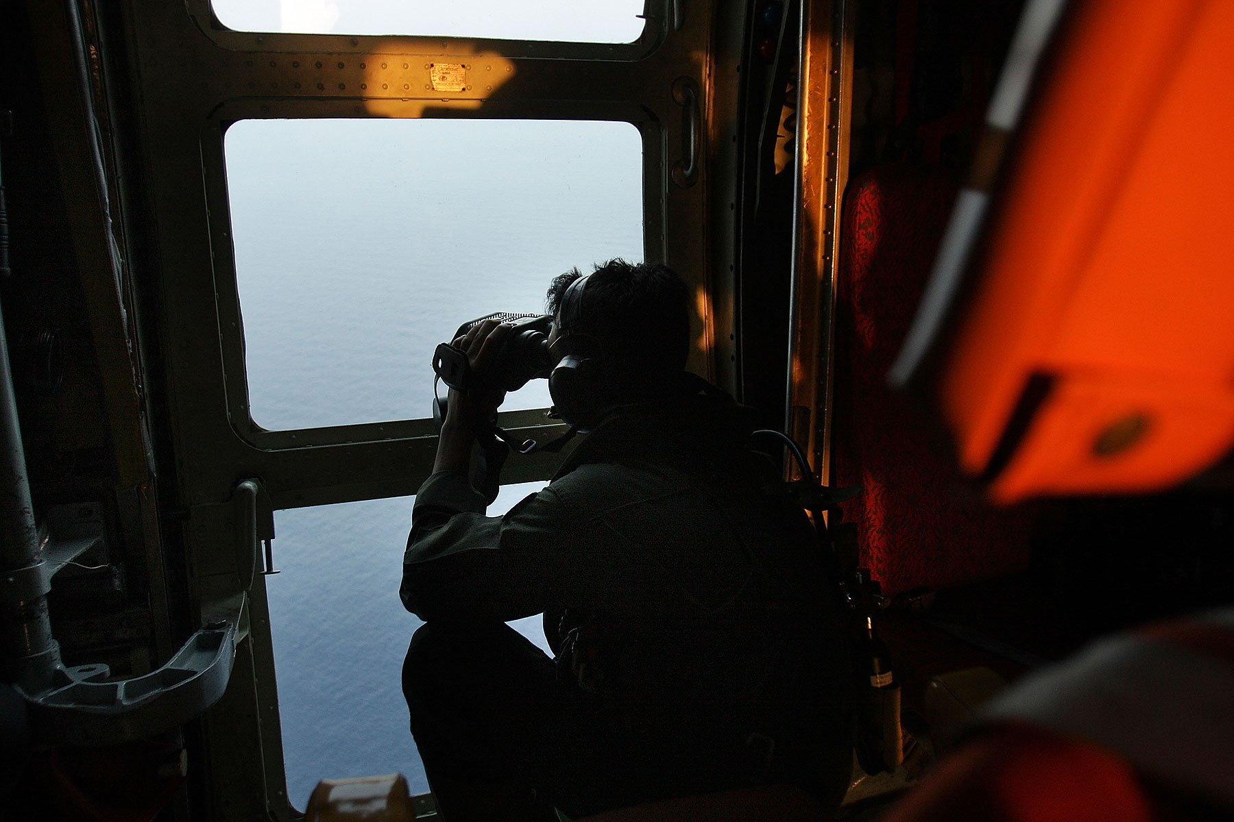 Malaysian Air Forces search the water for signs of debris from the Malaysian airliner during a search and rescue mission flight on March 13, 2014 in Kuala Lumpur, Malaysia