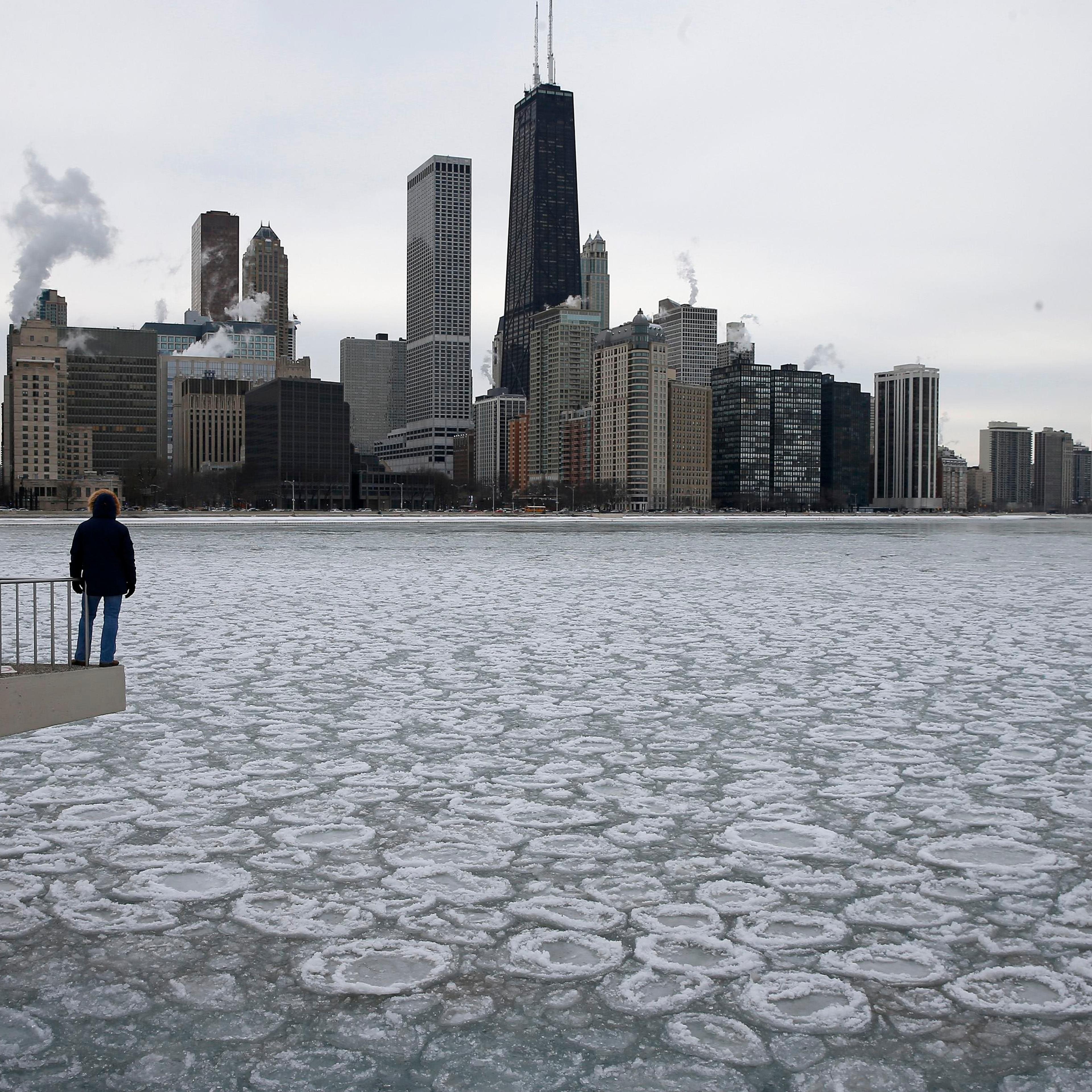 Charles Martinez looks over the partially frozen Lake Michigan and the Chicago skyline on Jan. 5, 2015.