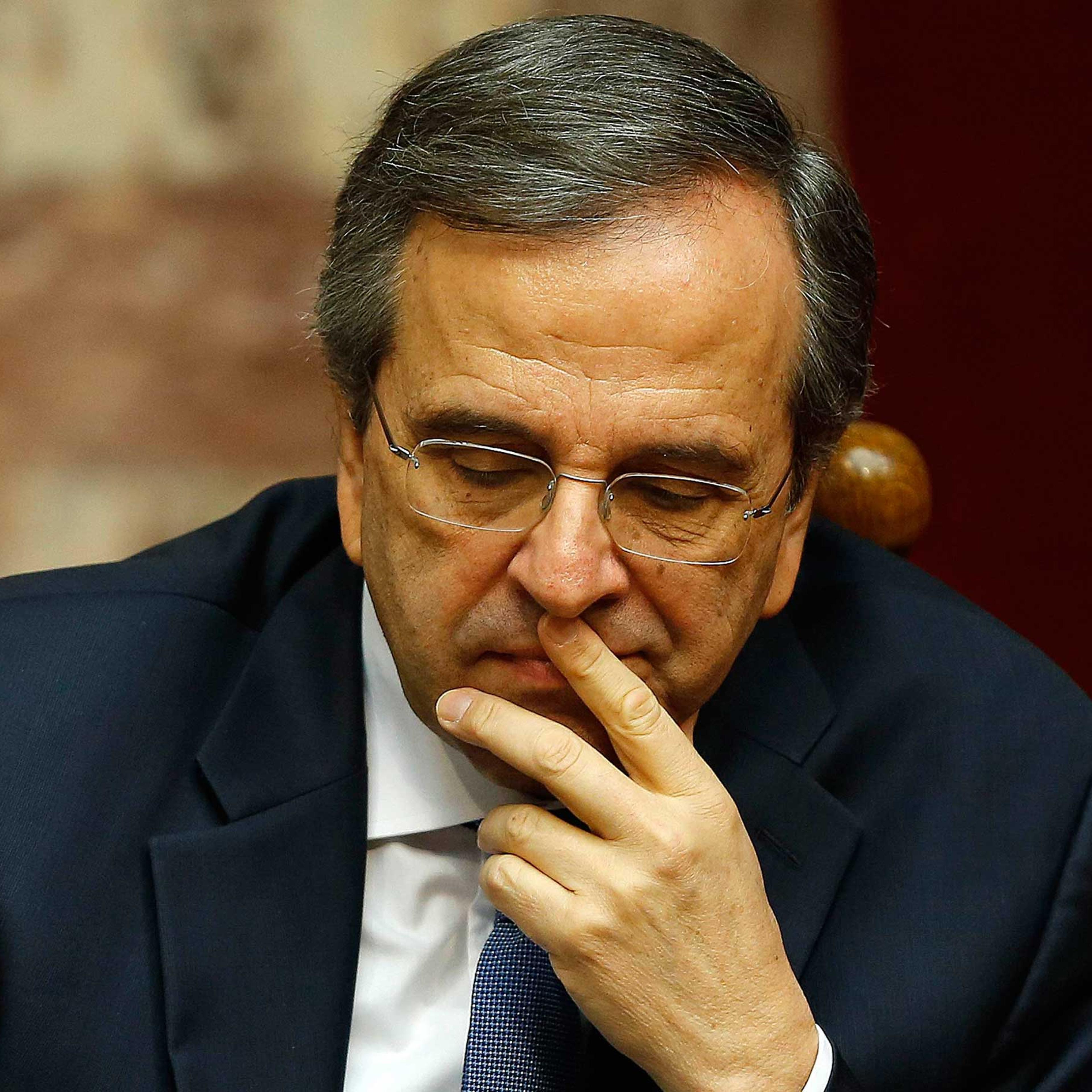 Greek Prime Minister Samaras reacts in parliament during the last round of a presidential vote in Athens