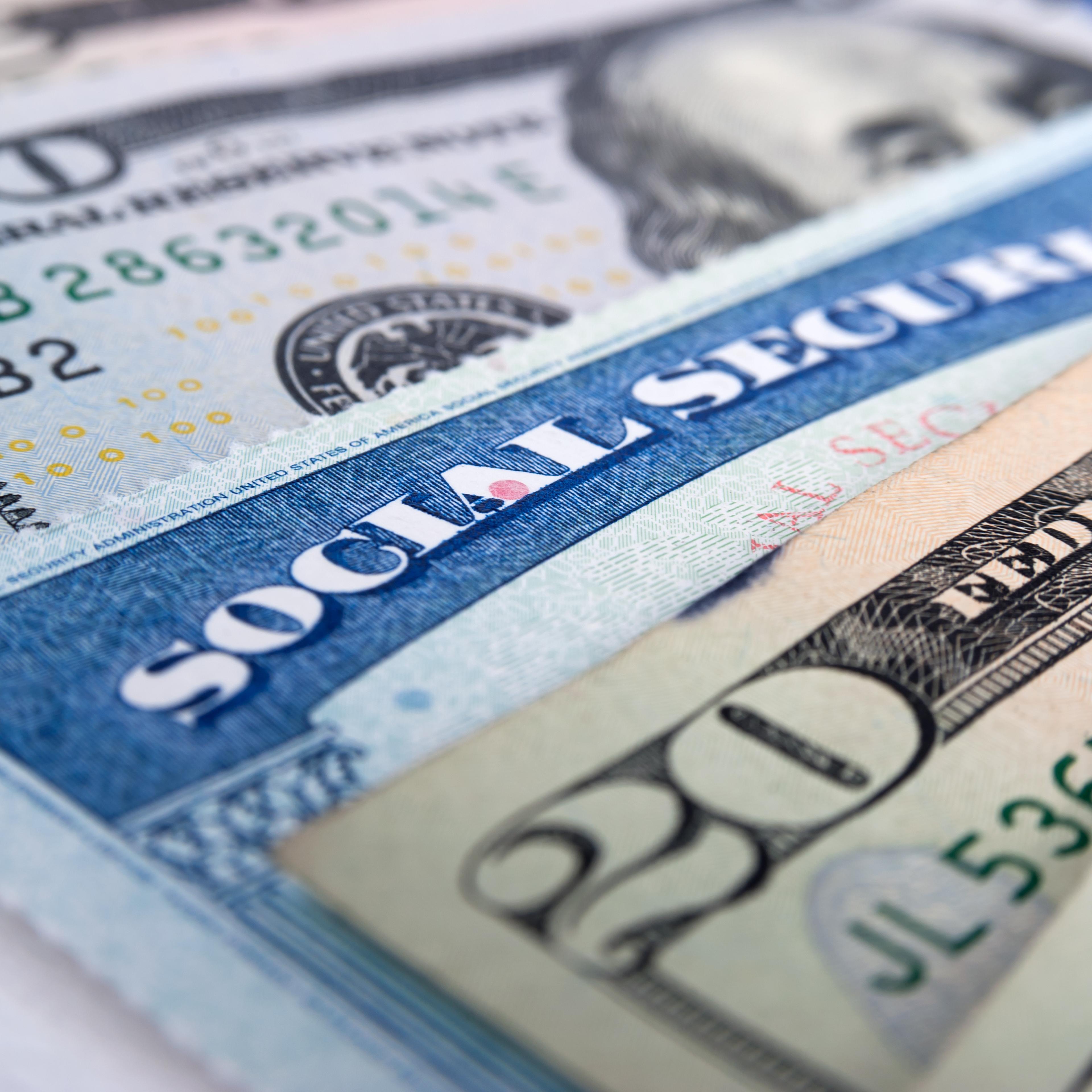 Social security card and American money dollar bills