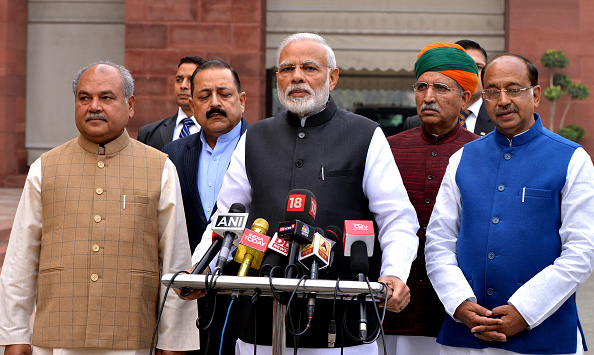 NEW DELHI, Dec. 12, 2018 -- Indian Prime Minister Narendra Modi front C speaks to media in New Delhi, India, Dec. 11, 2018. Indian Prime Minister Narendra Modi accepted his Bharatiya Janata Party's defeat in the just-concluded assembly elections in five 