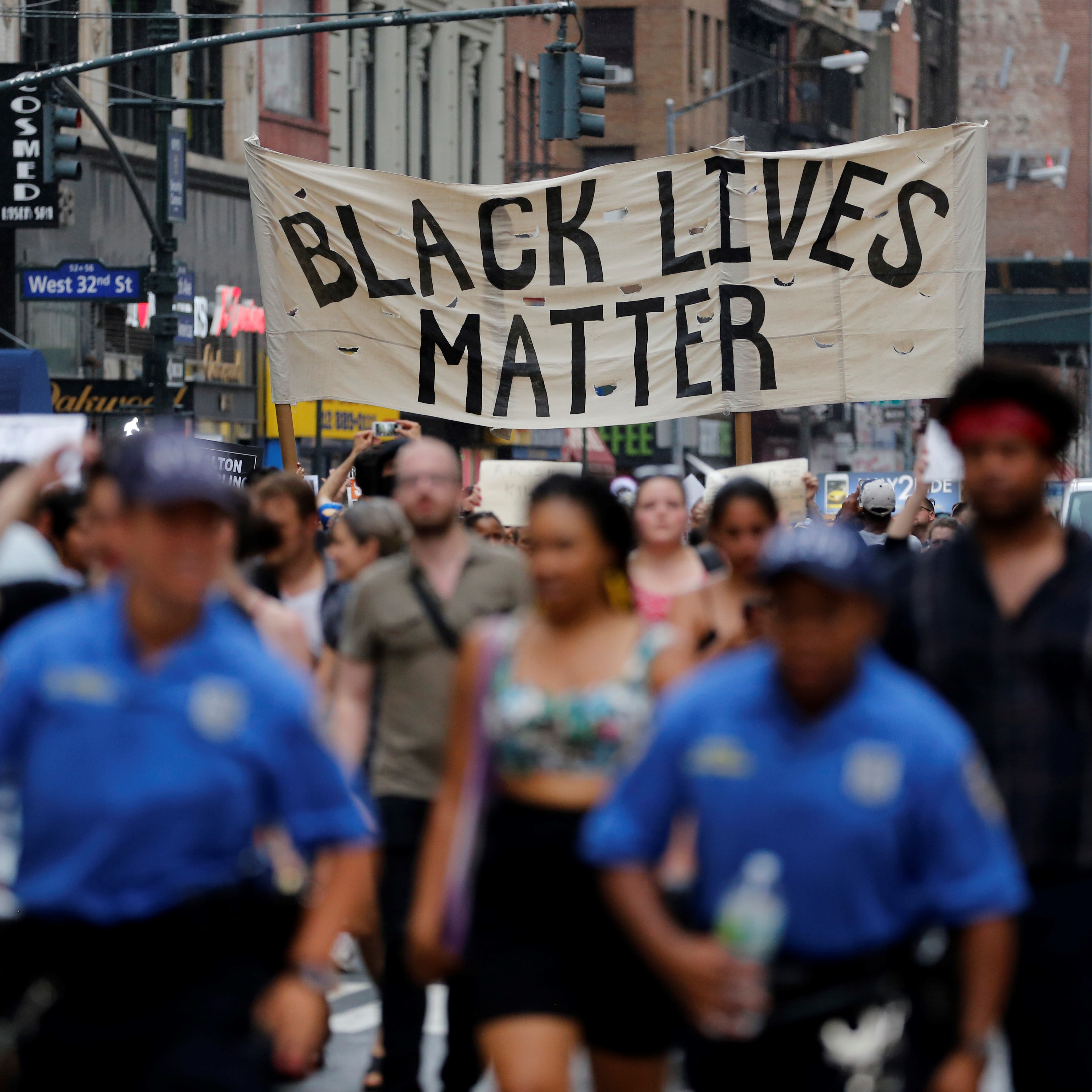 Hundreds gather in Manhattan on July 7 to protest recent police-related shootings