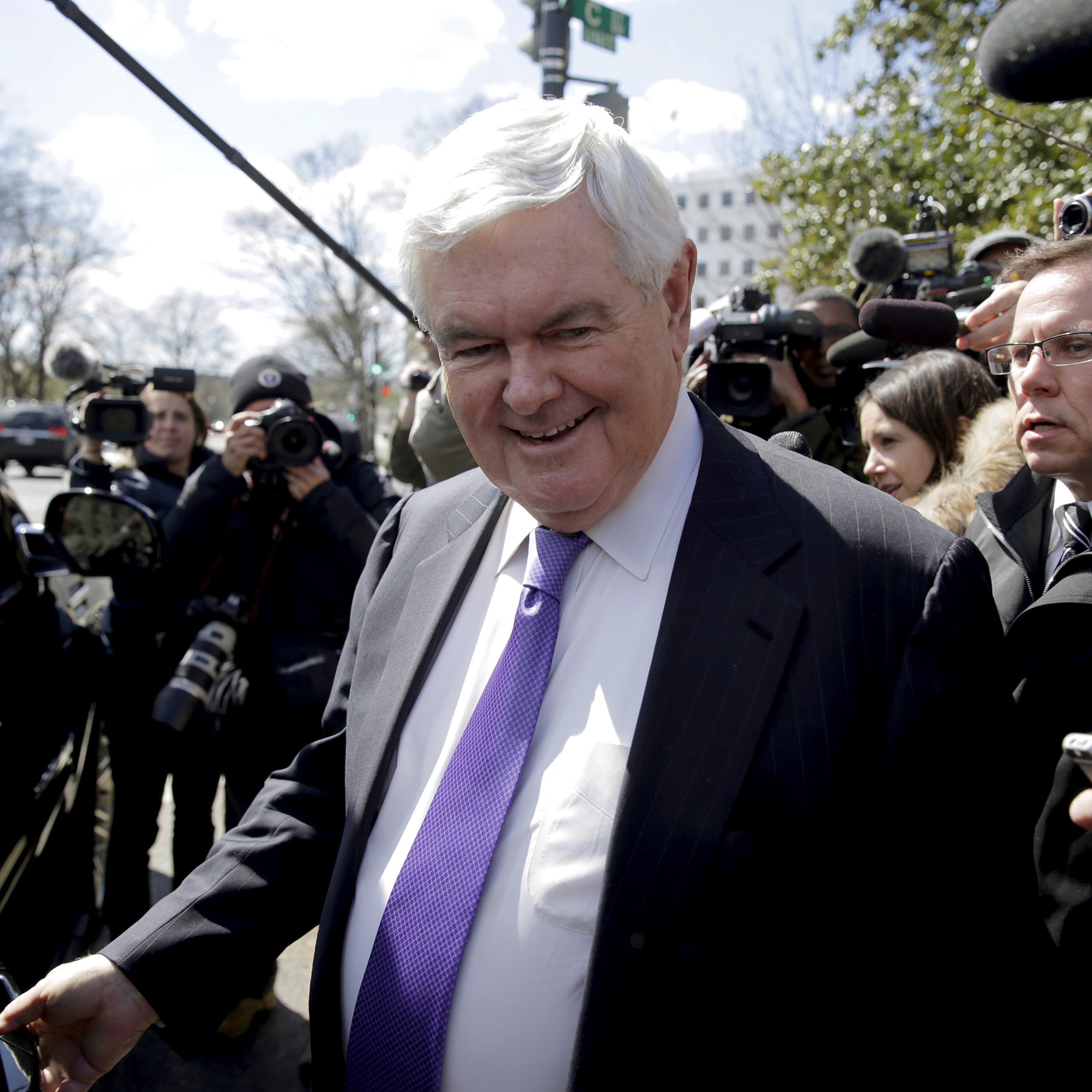 Newt Gingrich is followed by the media as he walks from a meeting with Republican presidential candidate Donald Trump in Washington, March 21, 2016.
