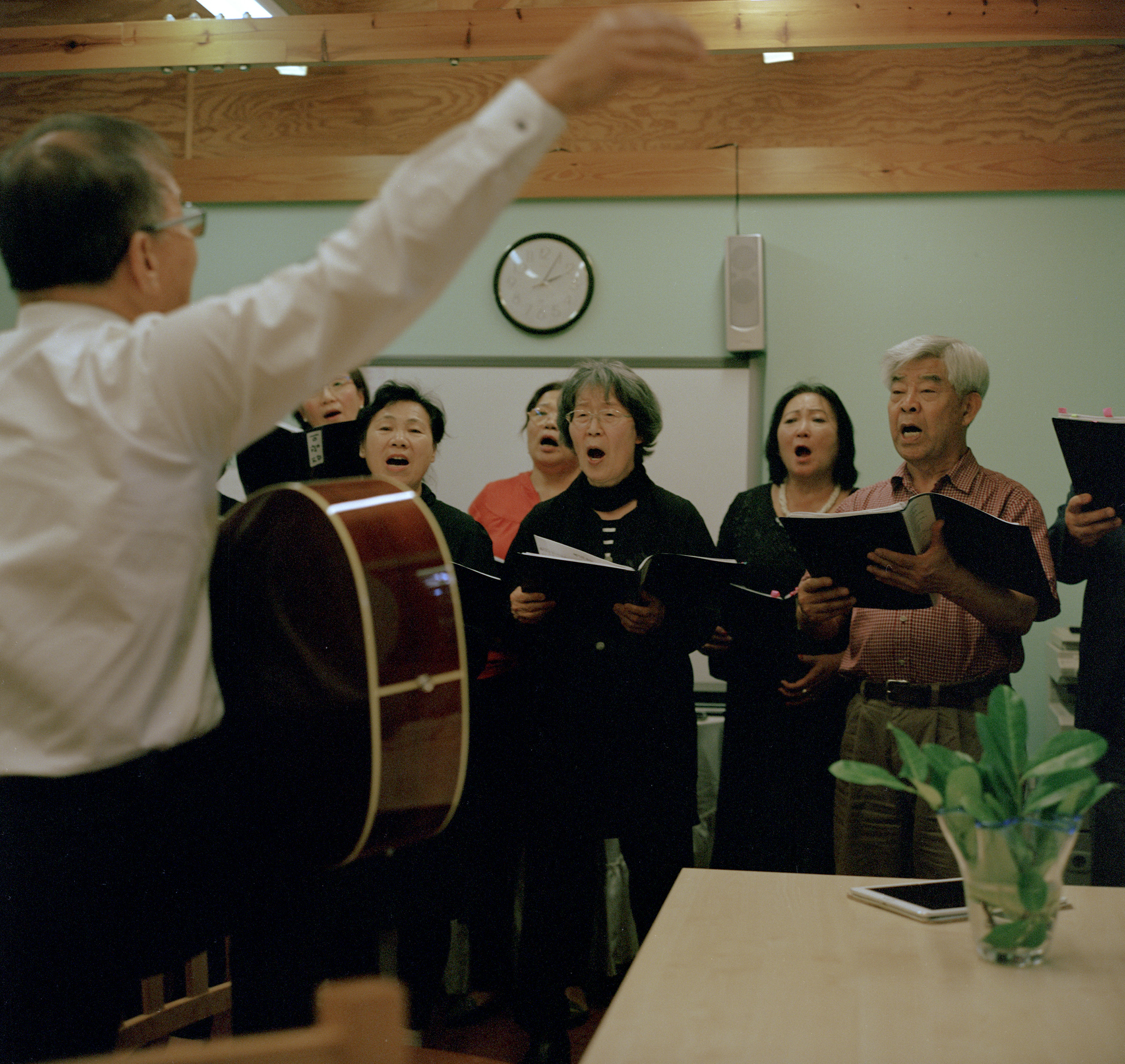 A group of South Koreans, North Koreans, and Korean Chinese sing together at the Korean Senior Citizens centre, New Malden, on Sept. 15.