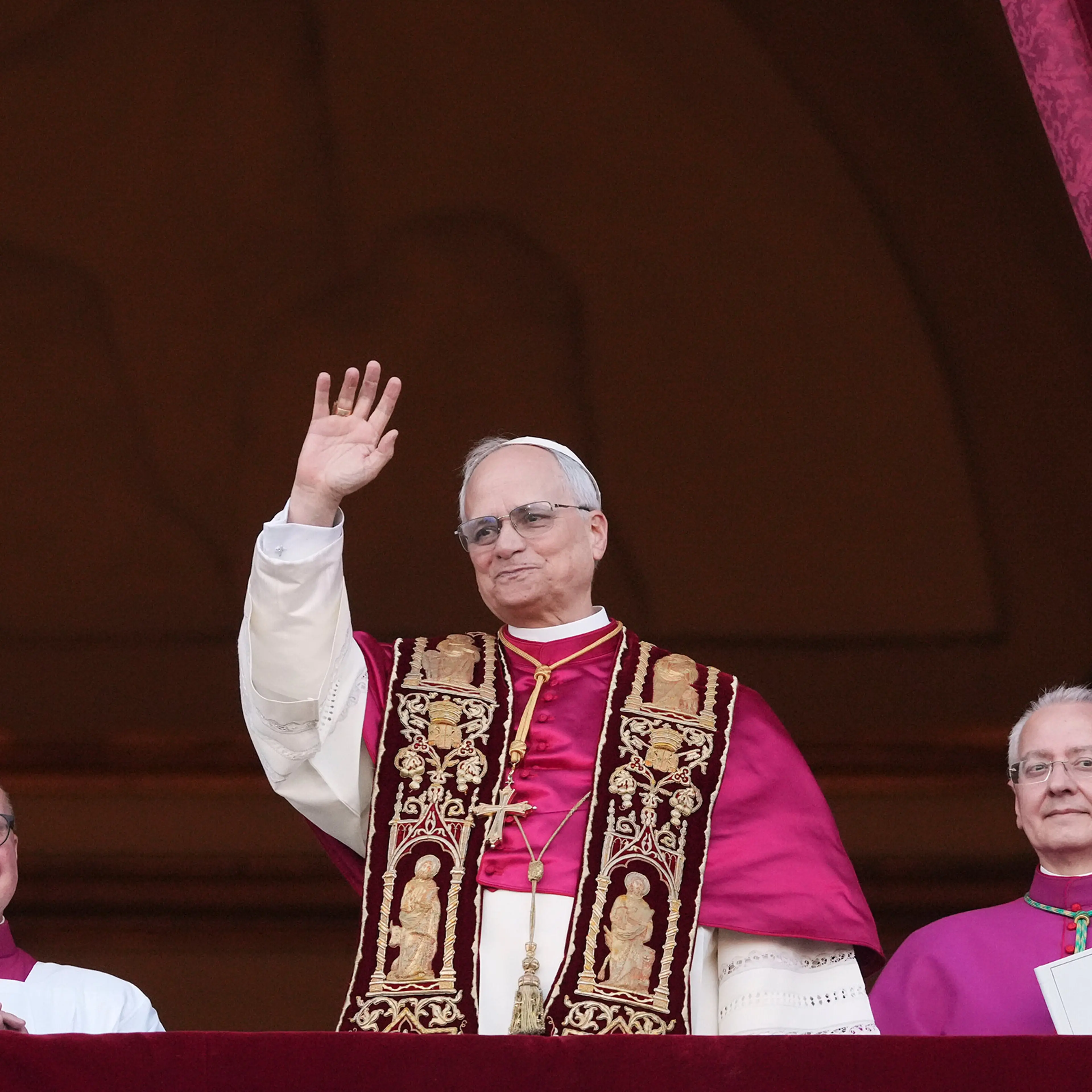 Cardinal Robert Prevost appears on the central loggia of St. Peter's Basilica after being chosen the 267th pontiff of the Roman Catholic Church, choosing the name of Pope Leo XIV, at the Vatican, Thursday, May 8, 2025.